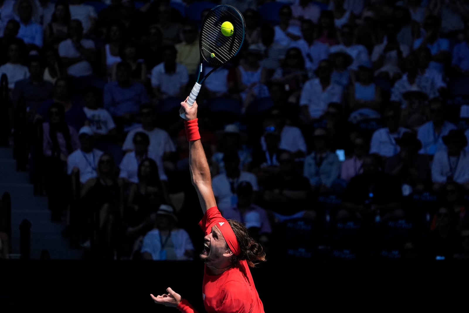 Alexander Zverev of Germany serves to Tommy Paul of the U.S. during their quarterfinal match at the Australian Open tennis championship in Melbourne, Australia, Tuesday, Jan. 21, 2025. (AP Photo/Asanka Brendon Ratnayake)