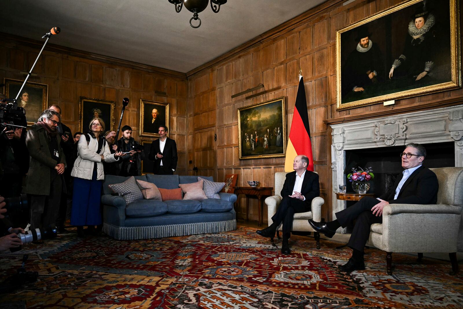 Members of the media cover the meeting between Britain's Prime Minister Keir Starmer, right, and Germany's Chancellor Olaf Scholz at the Chequers, in Aylesbury, England, Sunday, Feb. 2, 2025. (Ben Stansall/Pool Photo via AP)