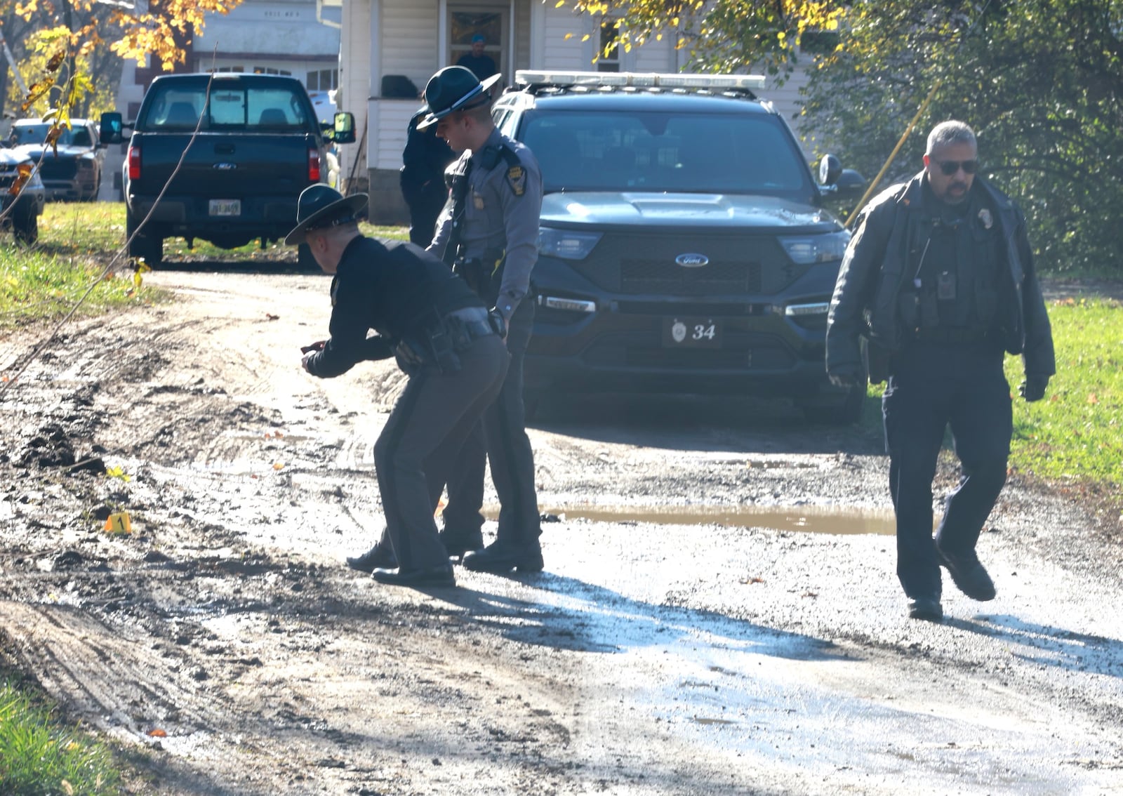 The Springfield Police and State Highway Patrol investigate a scene in an alley between Johnny Lytle and Southern Avenue, near where shots were fired Tuesday, Nov. 26, 2024. BILL LACKEY/Staff