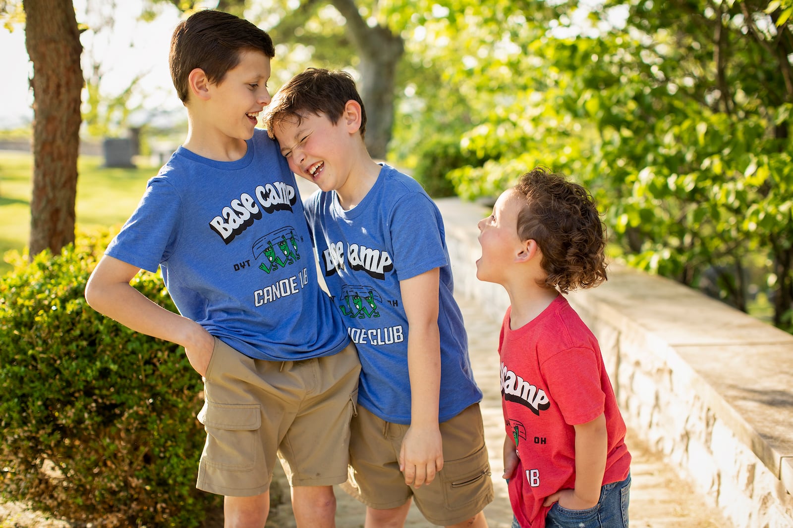 Andrew (L), 10, Albie, 8 and Ari, 5 pose for pictures in their parents' company Base Camp Outdoors Co T-Shirts last June.