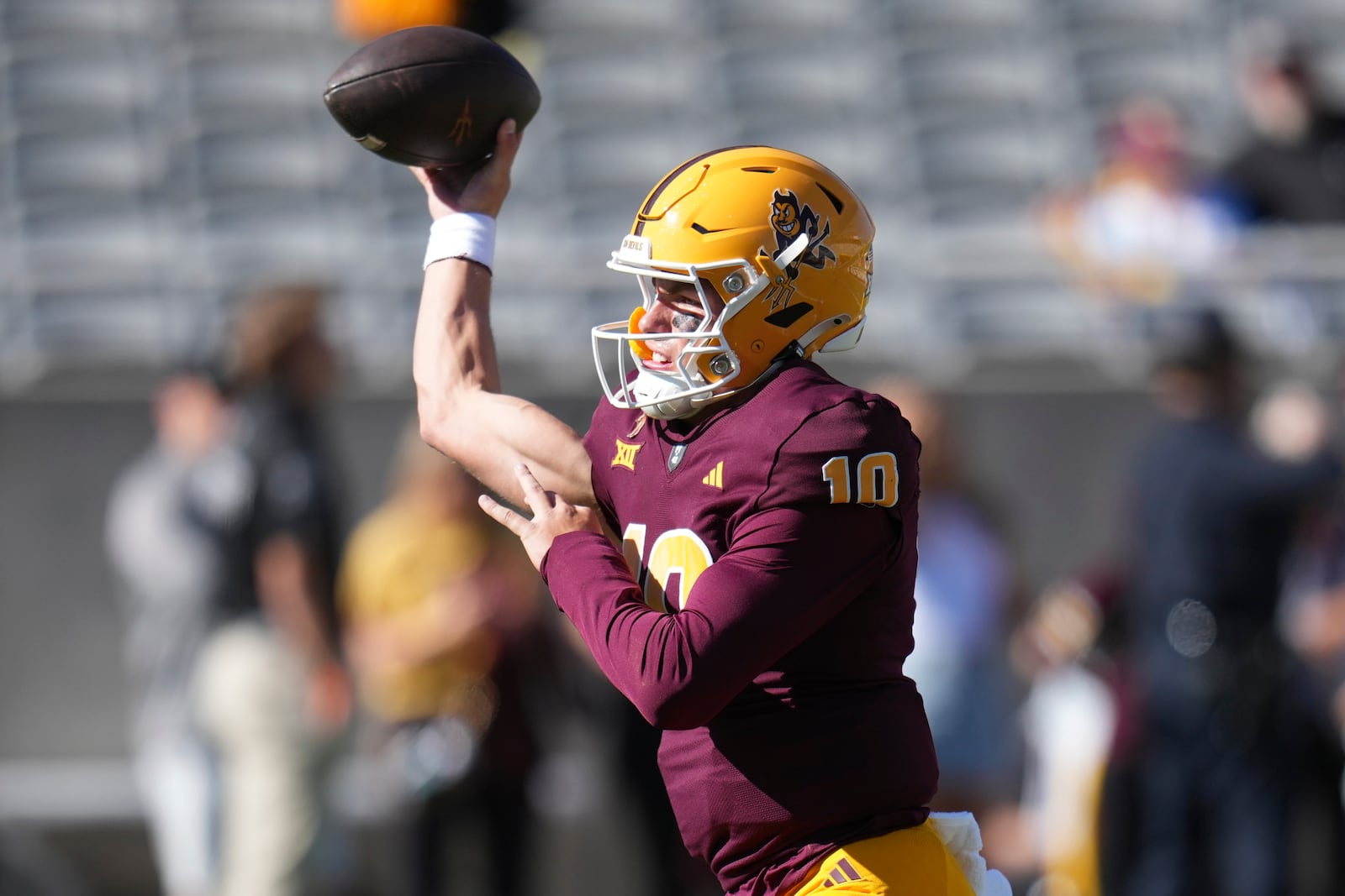 Arizona State quarterback Sam Leavitt warms up before an NCAA college football game against BYU, Saturday, Nov. 23, 2024, in Tempe, Ariz. (AP Photo/Ross D. Franklin)