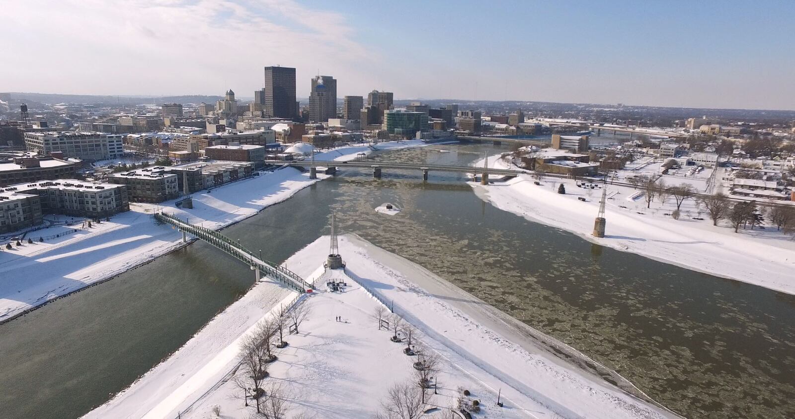 Ice flows down the Great Miami River, right at the confluence with the Mad River at Deeds Point.  Snow fell across the Miami Valley from Sunday night into Monday night closing churches, schools and businesses into Tuesday.   TY GREENLEES / STAFF