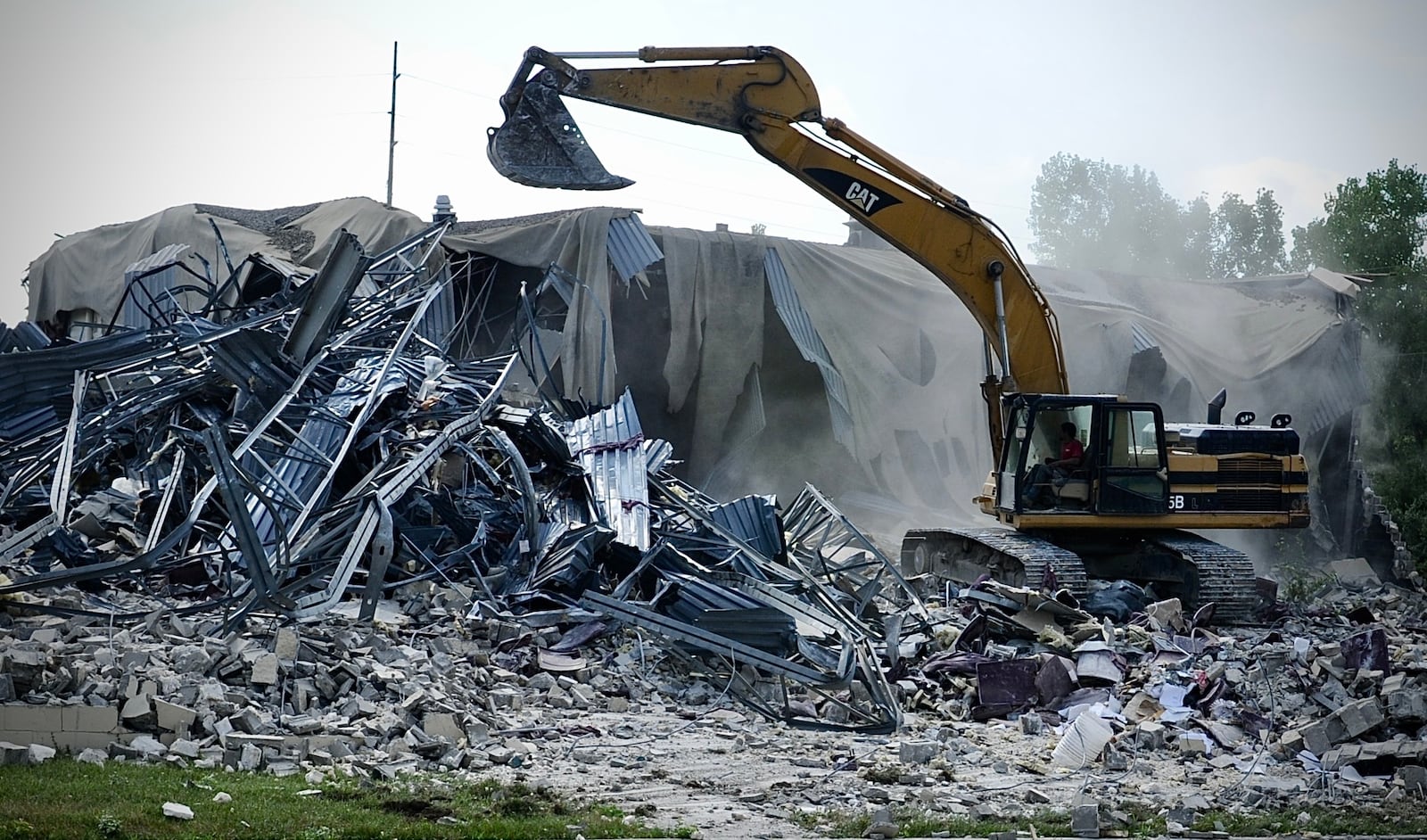 Crews demolish the former site of Danbarry Cinemas behind the Dayton Mall in Miami Twp. Tuesday, July 12, 2022.
MARSHALL GORBY/STAFF