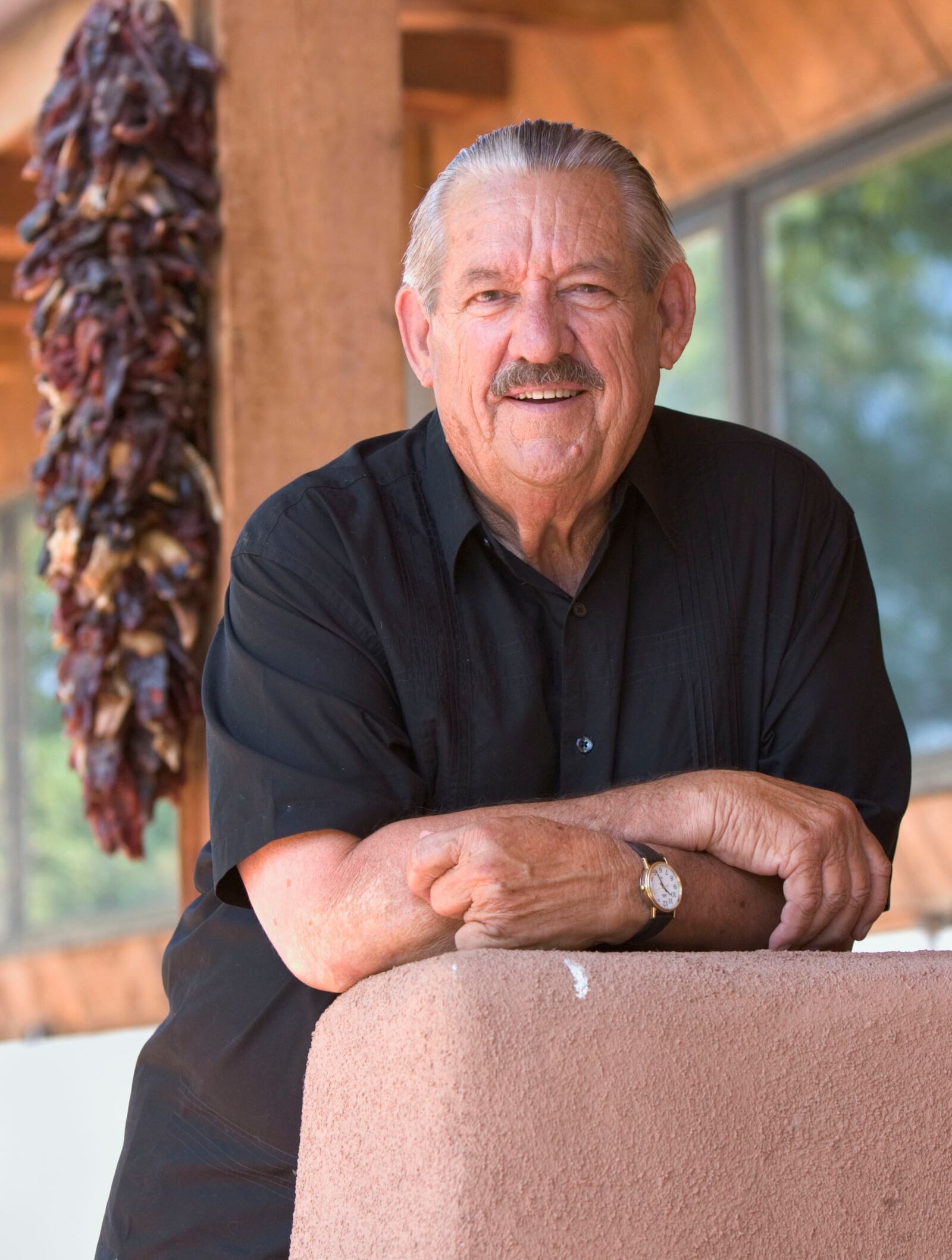 FILE - Former Oklahoma Sen. Fred Harris stands outside his Corrales, N.M., home, Friday, July 23, 2004. (AP Photo/Jake Schoellkopf, File)