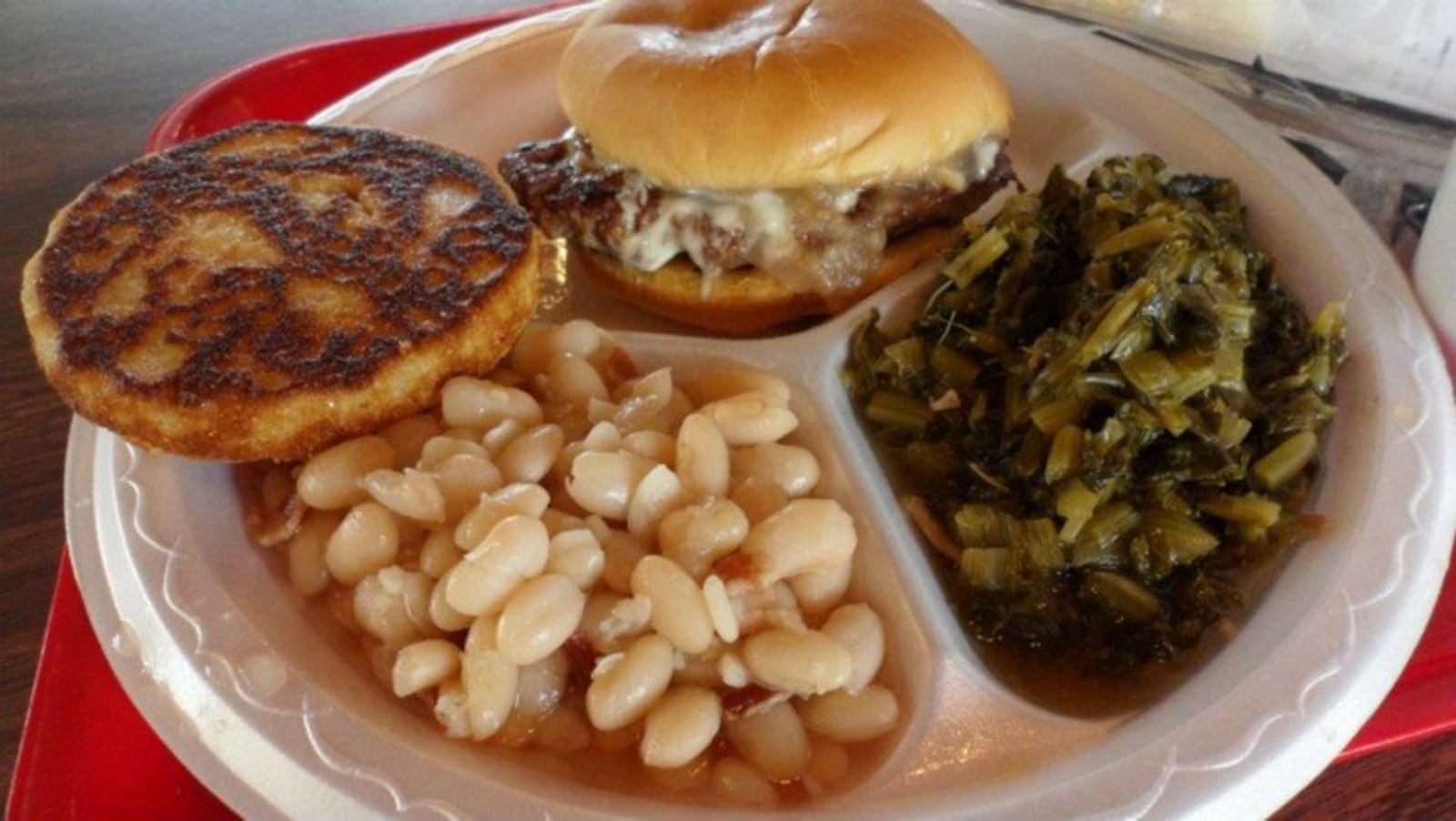 Benjamin s The Burger Master s Burger Platter shown in an order that added a piece of skillet cornbread. CONTRIBUTED