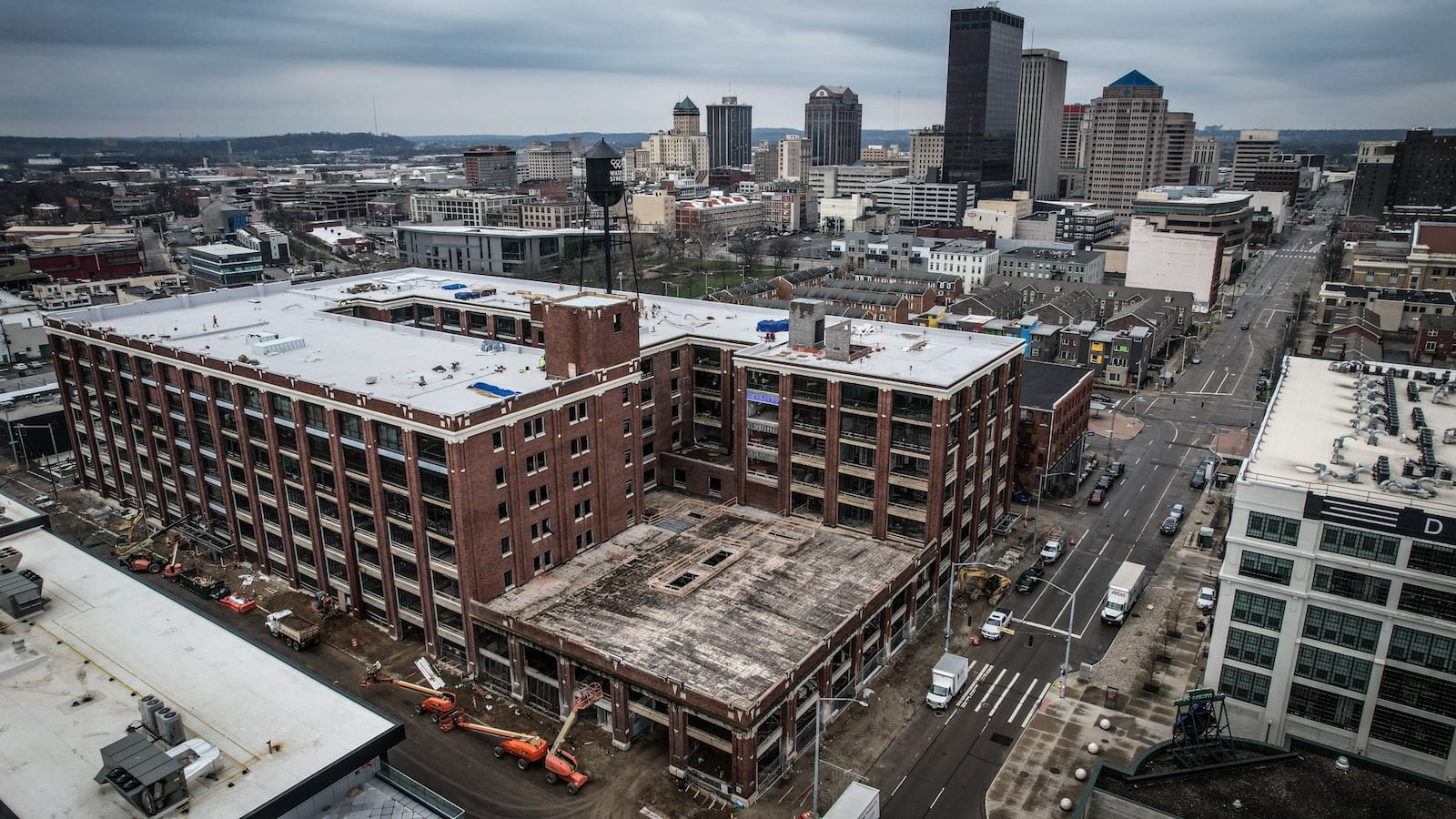 The former Mendelsons building is rehabilitated into 160 residential units, 77,400 square feet of office space, 19,600 square feet of ground floor retail and restaurant space and a parking garage with 482 spaces. The Mendelsons building in the past was called one of Dayton's "great white whales" because people believed it had extraordinary redevelopment potential but a very high cost to make that happen. JIM NOELKER/STAFF