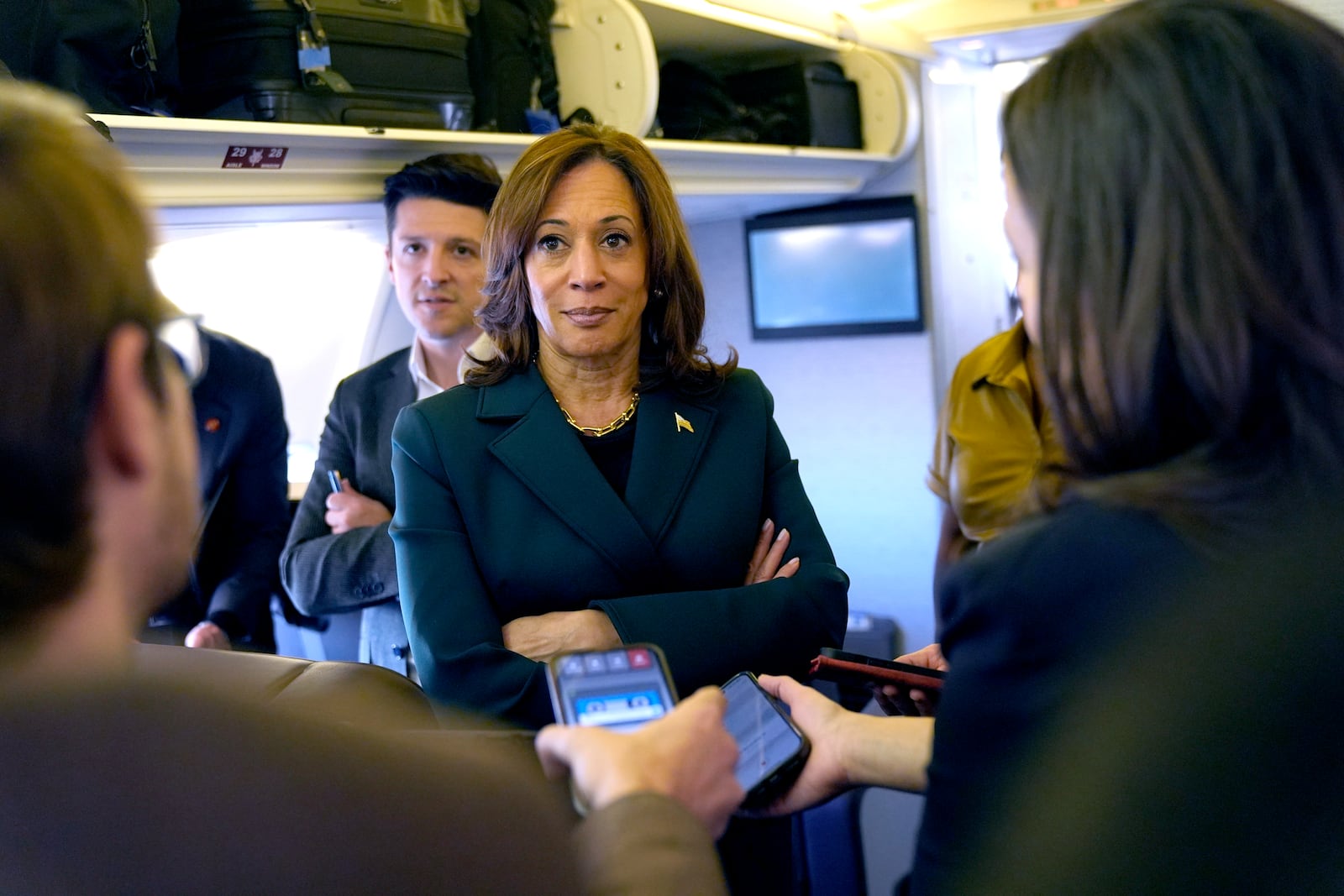 Democratic presidential nominee Vice President Kamala Harris speaks with members of the press on board Air Force Two at Philadelphia International Airport, Monday, Oct. 21, 2024, in Philadelphia, before departing to Michigan. (AP Photo/Jacquelyn Martin, Pool)