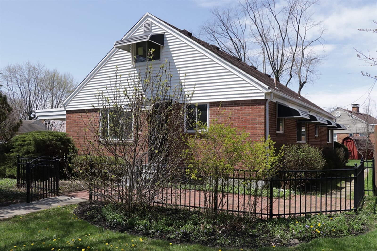 One side yard has a storage shed while the other side yard has a paver-brick patio with gated entry to a side-entry to the house. CONTRIBUTED PHOTO BY KATHY TYLER