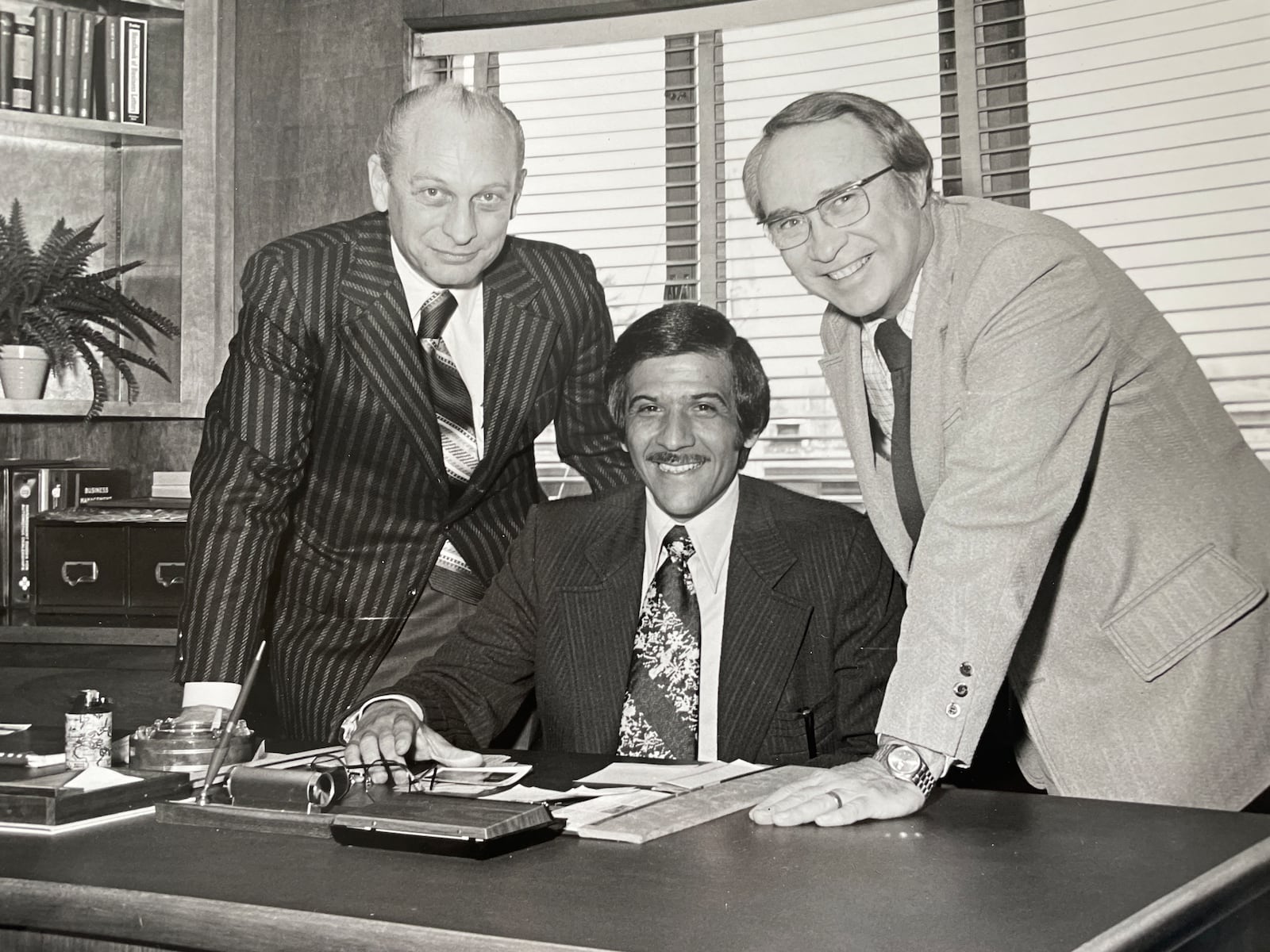 Robert “Bob” Ross, Sr., (middle) when he purchased Vivian Buick, Opel and International Harvester Trucks in Richmond, Ind. in February 1974. CONTRIBUTED