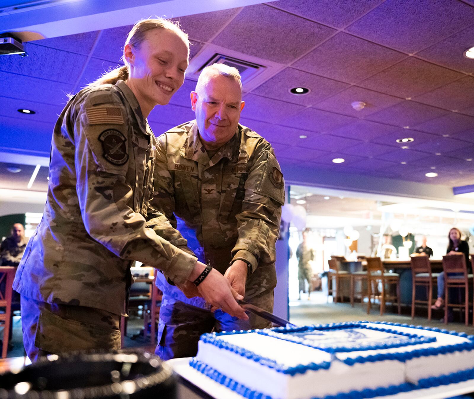 Col. Kim Bowen, 88th Air Base Wing chaplain, and Airman 1st Class Hannah Flamm, an 88th Security Forces Squadron Defender, cut the cake Sept. 16, 2022, in celebration of the Air Force’s 75th birthday at Wright-Patterson Air Force Base, Ohio. It’s traditional for the oldest and youngest Airmen to cut the birthday cake. (U.S. Air Force photo by Hannah Carranza) 