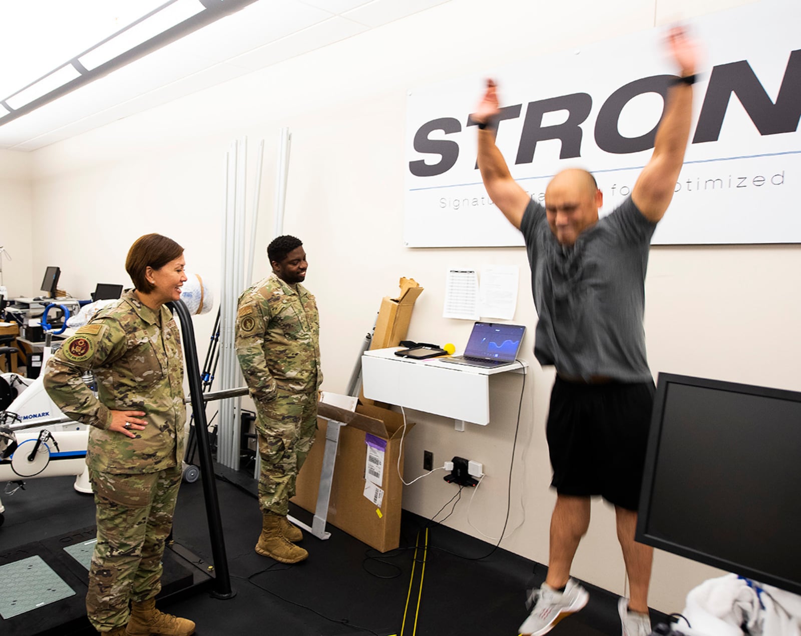 Chief Master Sgt. of the Air Force JoAnne S. Bass watches June 16 as Tech. Sgt. Roric Ongaco demonstrates equipment that measure different forces employed in a jump in the 711th Human Performance Wing’s Signature Tracking for Optimized Nutrition and Training Lab, Wright-Patterson Air Force Base. The lab is responsible for developing, testing and transitioning technologies to enhance the physical & cognitive training, readiness and performance of Airmen. U.S. AIR FORCE PHOTO/R.J. ORIEZ