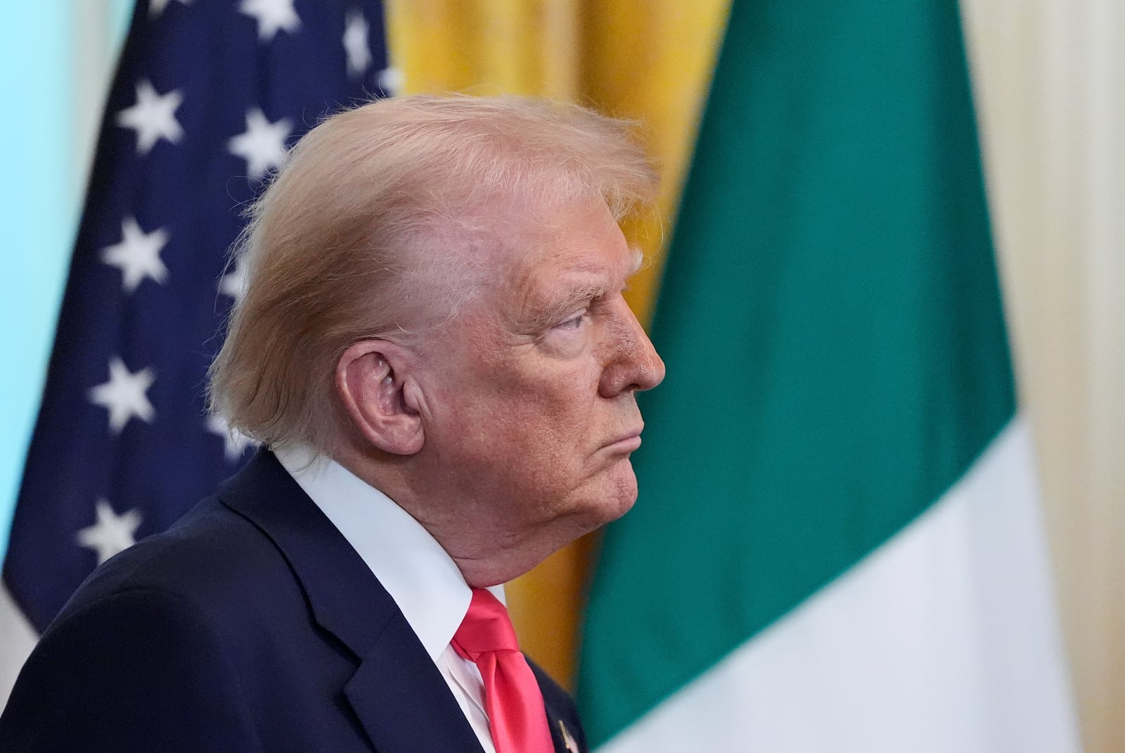 President Donald Trump listens as Ireland's Prime Minister Micheál Martin speaks during an event in the East Room of the White House in Washington, Wednesday, March 12, 2025. (AP Photo/Alex Brandon)