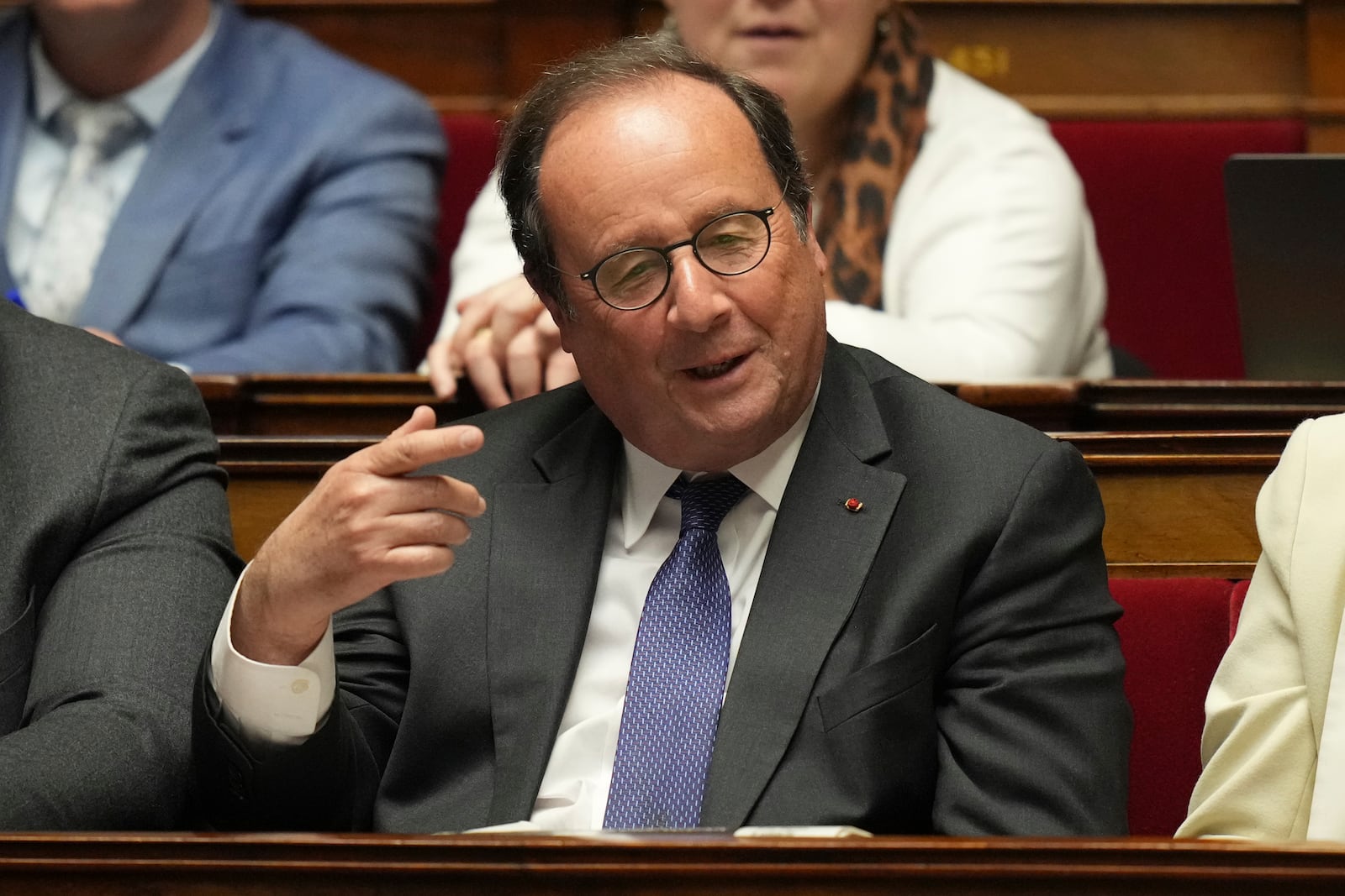 Former French President Francois Hollande gestures as he listens to French Prime Minister Francois Bayrou delivering his general policy speech, Tuesday, Jan. 14, 2025 at the National Assembly in Paris. (AP Photo/Thibault Camus)