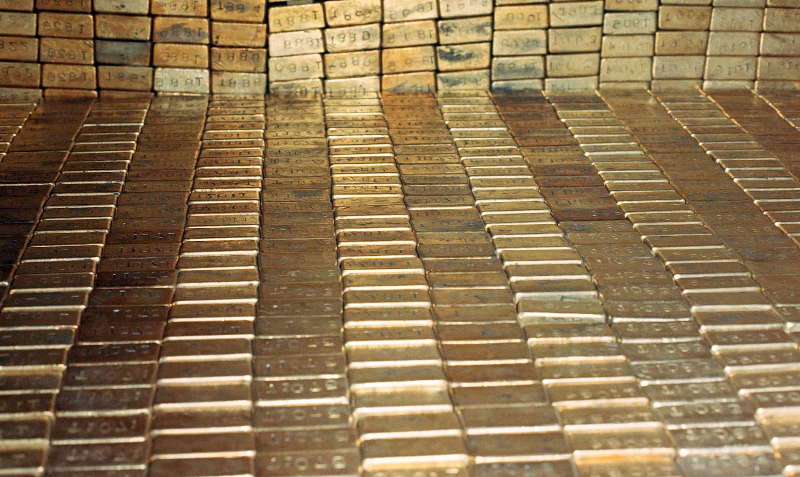 FILE - Gold bars are stored at the U.S. Depository in Ft. Knox, Kentucky, Sept. 24, 1974. (AP Photo/Barry Thumma, File)