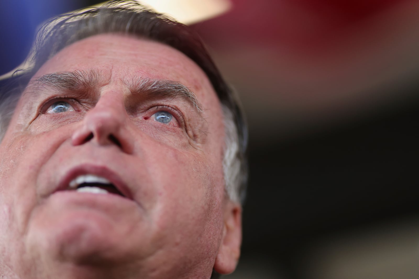 Former Brazil's President Jair Bolsonaro speaks to the media, as he arrives at the International Airport, Brasilia, Brazil, Tuesday, March 25, 2025. (AP Photo/Luis Nova)