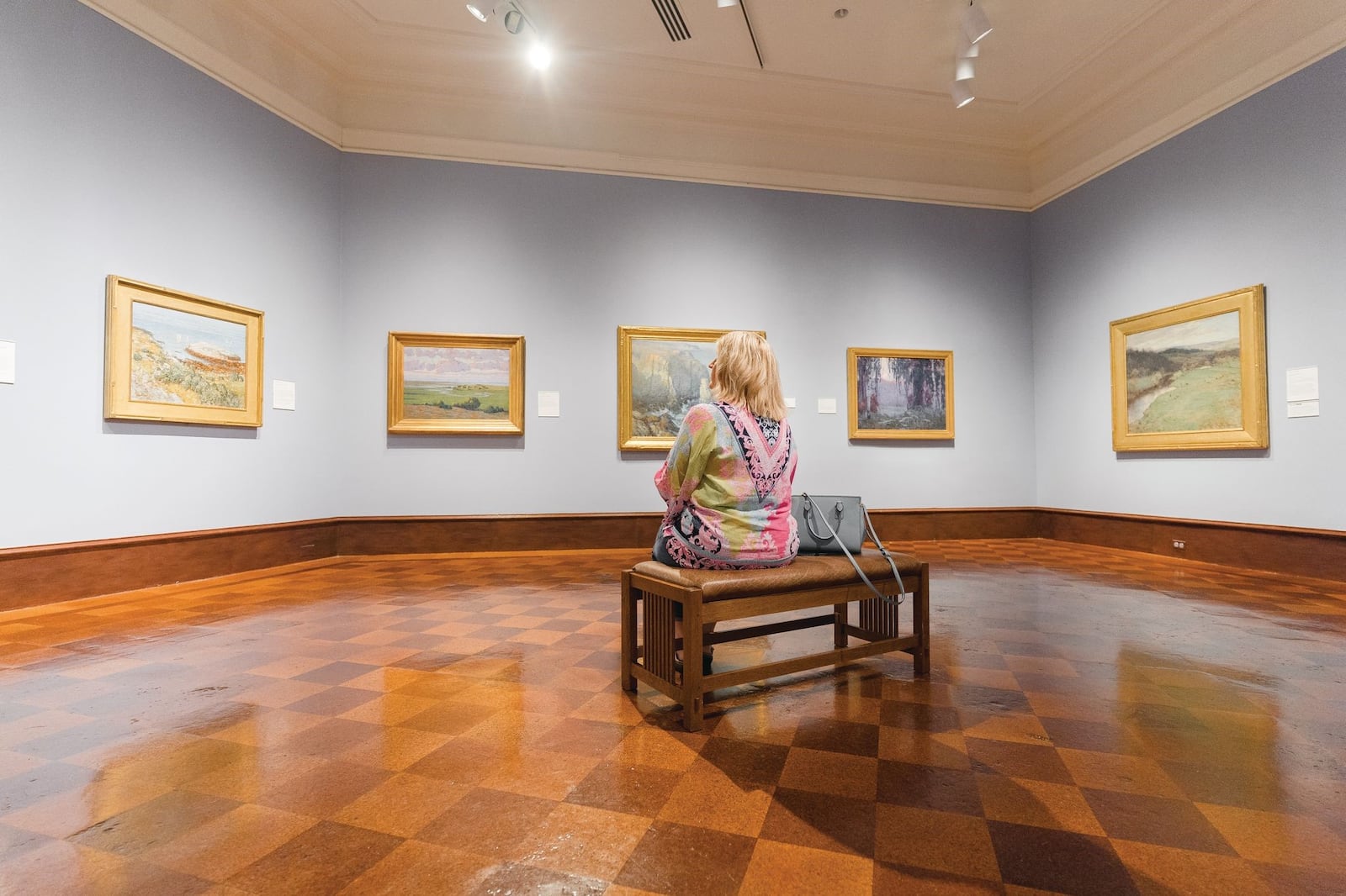 A guest ponders the artwork within the Dayton Art Institute. CONTRIBUTED