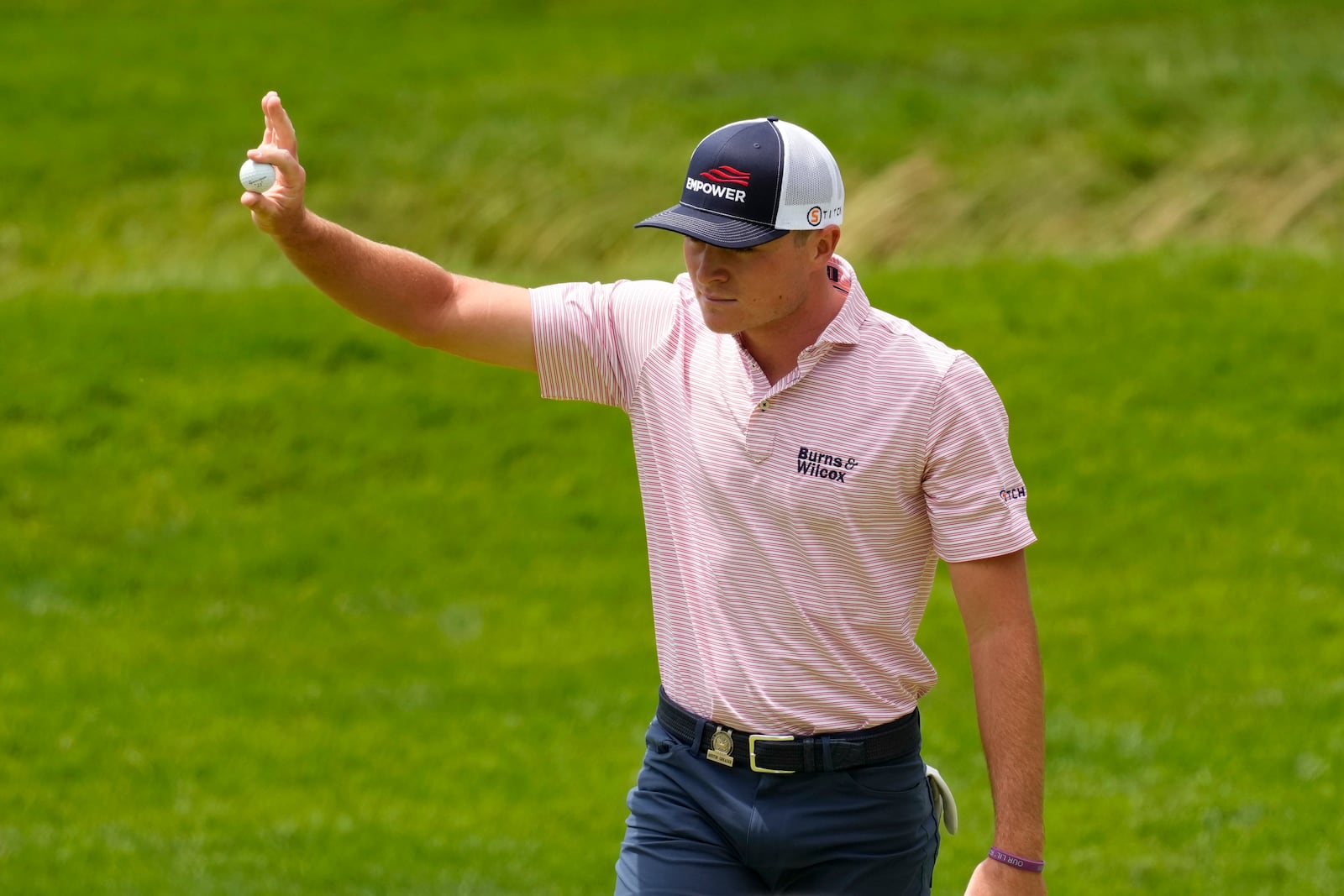 Austin Greaser reacts after a putt on the 12th hole during the first round of the U.S. Open golf tournament at The Country Club, Thursday, June 16, 2022, in Brookline, Mass. (AP Photo/Charlie Riedel)