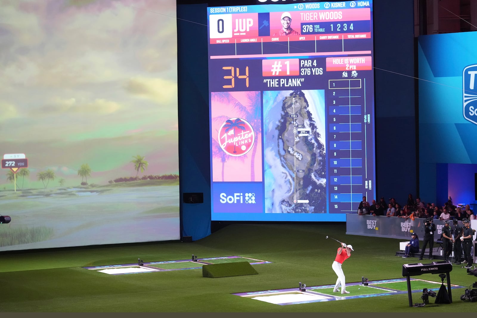 Tiger Woods hits during the first hole between Los Angeles Golf Club and his Jupiter Links Golf Club, Tuesday, Jan. 14, 2025, in Palm Beach Gardens, Fla. (AP Photo/Marta Lavandier)