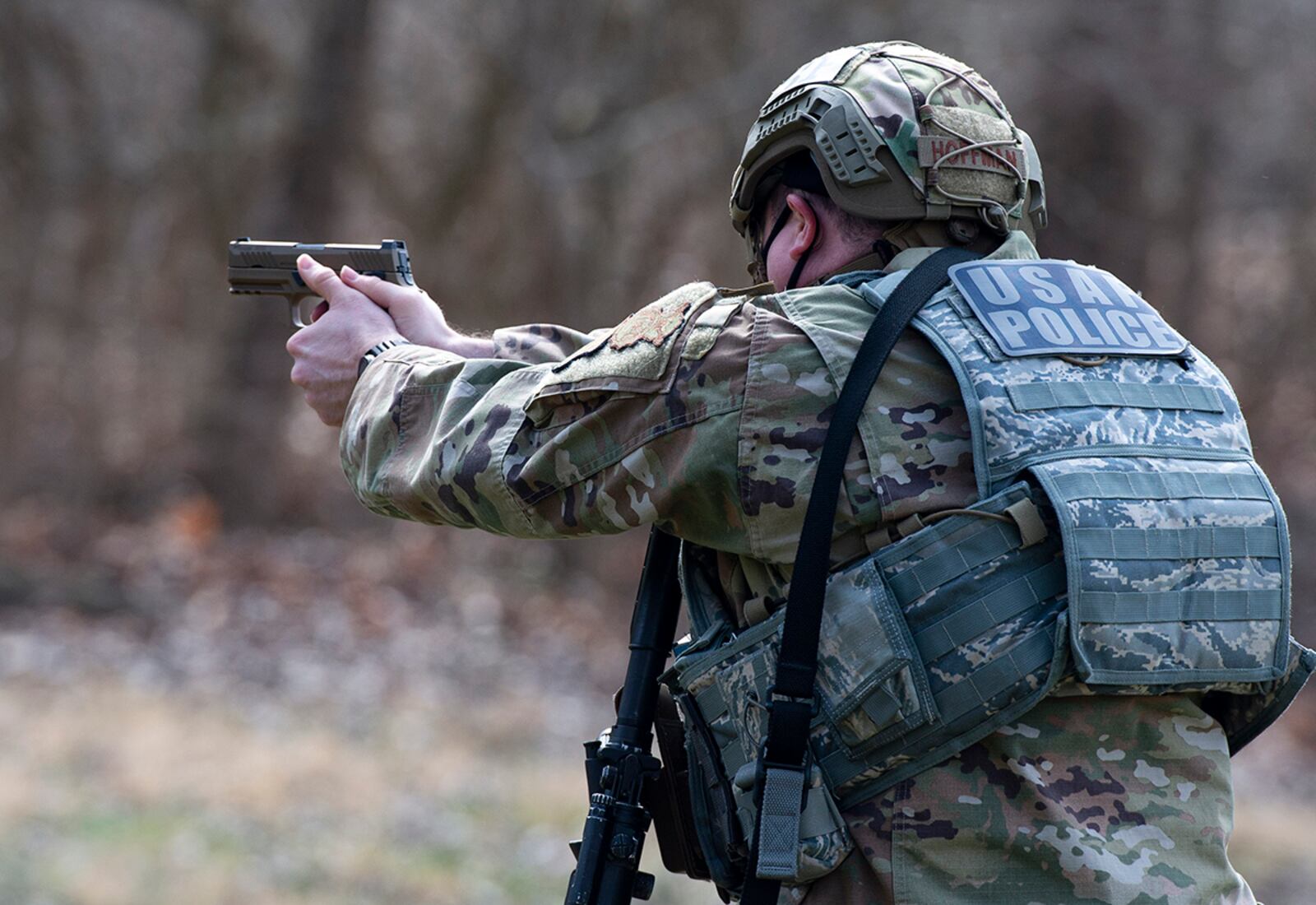 A member of the 88th Security Forces Squadron aims an M18 pistol at a fixed target during sustainment training at Wright-Patterson Air Force Base on March 17. U.S. AIR FORCE PHOTO/WESLEY FARNSWORTH