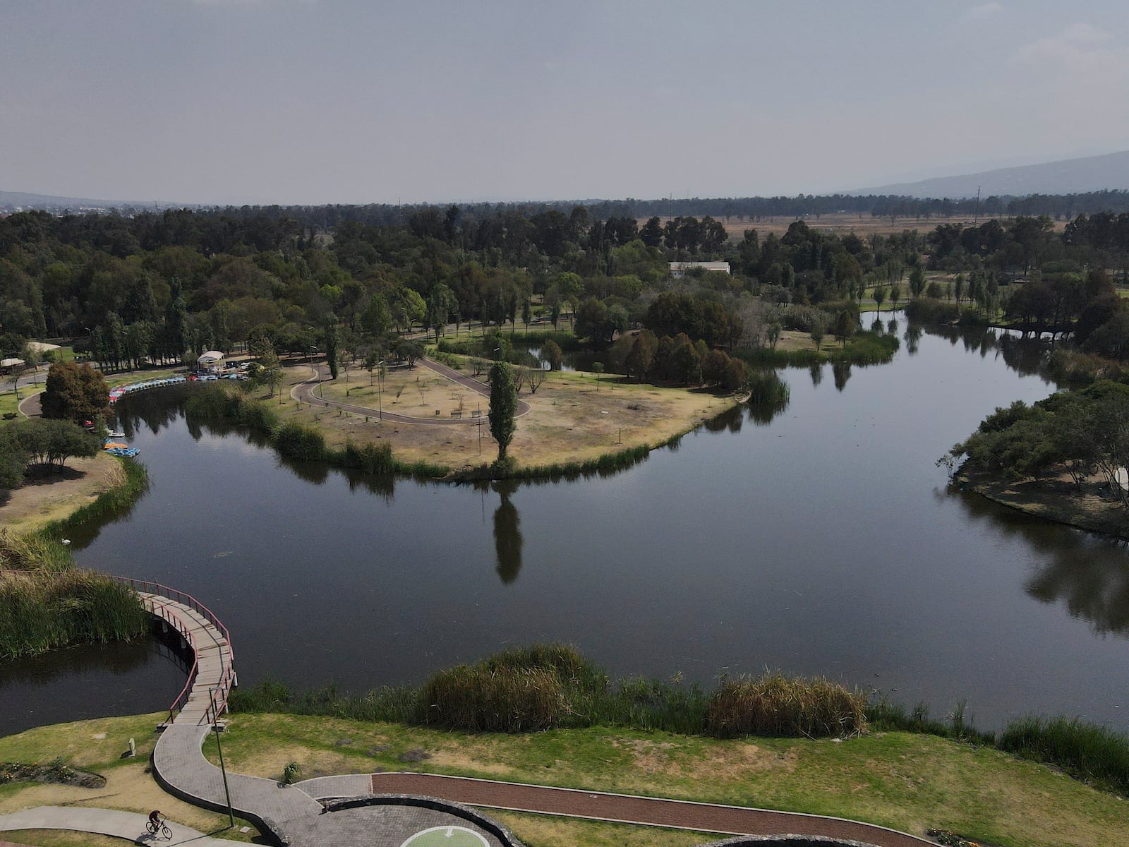 Trees surround a lake at Xochimilco Ecological Park, in Mexico City, Tuesday, Feb. 11, 2025. (AP Photo/Marco Ugarte)