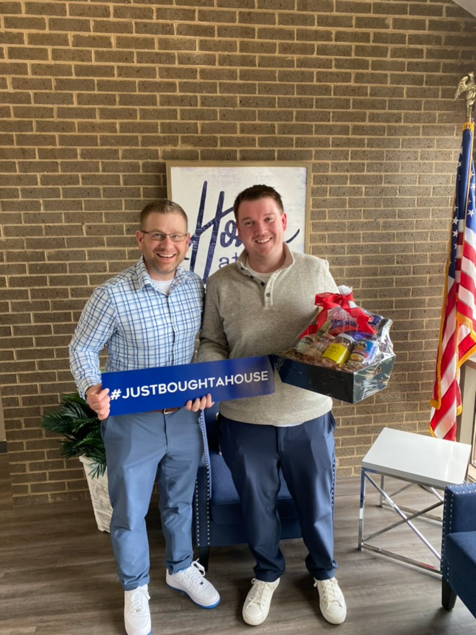 Andrew Nicholl (left) who has worked as a realtor for nearly 10 years, congratulates his client, who is a first-time homebuyer. CONTRIBUTED