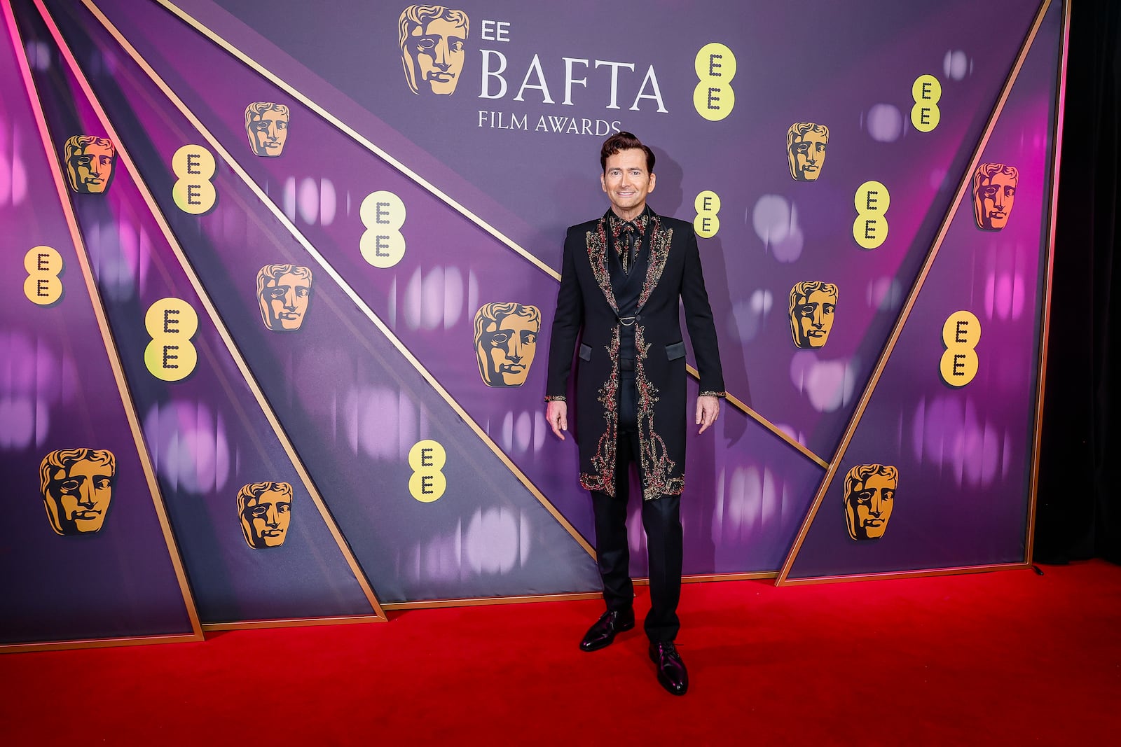 David Tennant poses for photographers upon arrival at the 78th British Academy Film Awards, BAFTA's, in London, Sunday, Feb. 16, 2025. (Photo by Joel C Ryan/Invision/AP)