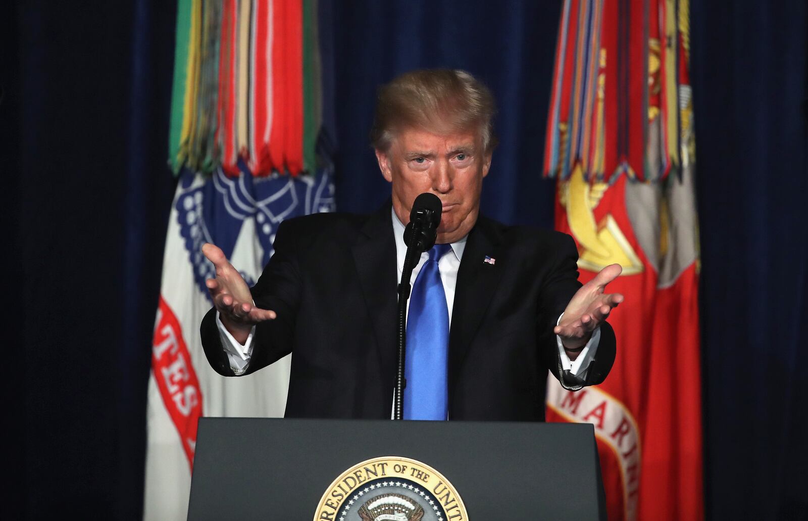 ARLINGTON, VA - AUGUST 21:  U.S. President Donald Trump delivers remarks on Americas military involvement in Afghanistan at the Fort Myer military base on August 21, 2017 in Arlington, Virginia. Trump was expected to announce a modest increase in troop levels in Afghanistan, the result of a growing concern by the Pentagon over setbacks on the battlefield for the Afghan military against Taliban and al-Qaeda forces.  (Photo by Mark Wilson/Getty Images) *** BESTPIX ***