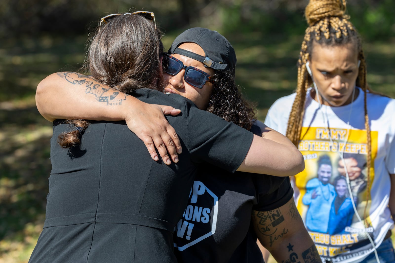 Lauren Sapp, center, deputy director of The Promise of Justice Initiative, hugs faith leaders and supporters of Jessie Hoffman Jr., who was convicted of a 1996 murder of Mary “Molly” Elliott, outside Louisiana State Penitentiary in Angola, La., for Hoffman's planned execution Tuesday, March 18, 2025. (Chris Granger/The Times-Picayune/The New Orleans Advocate via AP)