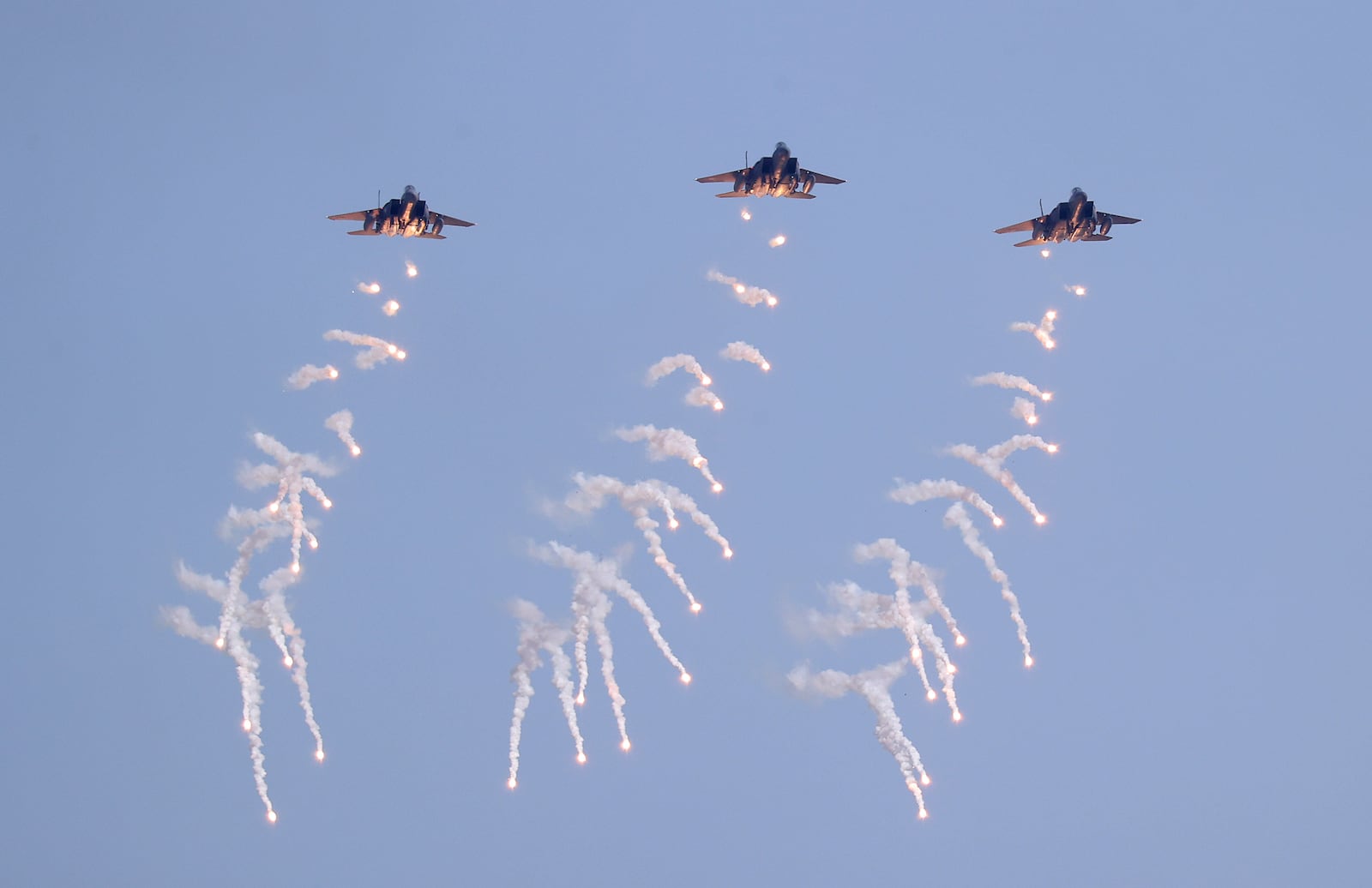 South Korean Air Force F-15K fighter jets fire flare shells during the joint military drill between South Korea and the United States at Seungjin Fire Training Field in Pocheon, South Korea, Thursday, March 6, 2025. (Yonhap via AP)