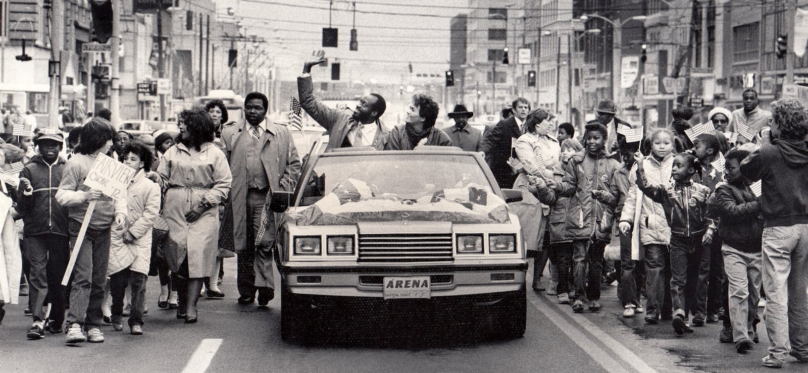 A parade for the two-time Olympic champion was held in downtown Dayton in 1984. Edwin C. Moses and his wife Myrella rode from Courthouse Square to Memorial Hall in a convertible with a patriotic banner covering the hood.More than 1,000 Dayton public school children walked alongside holding American flags high as Moses and his wife waved to the crowd on the streets. DAYTON DAILY NEWS ARCHIVE