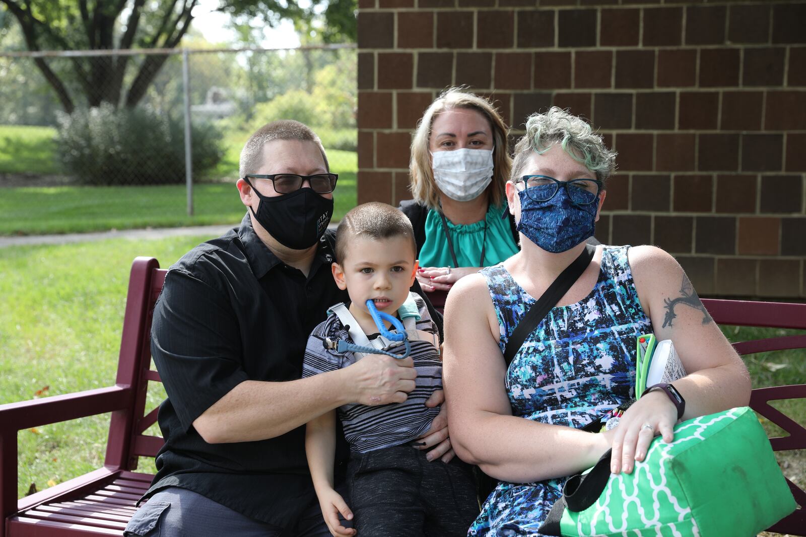 Ryker Carter, a boy who receives services from the Montgomery County Board of Developmental Disabilities, with his father, Matthew Carter, and mother, Sarah Carter, and his developmental specialist, Amanda Lowery, who is an expert in the field of autism. CONTRIBUTED