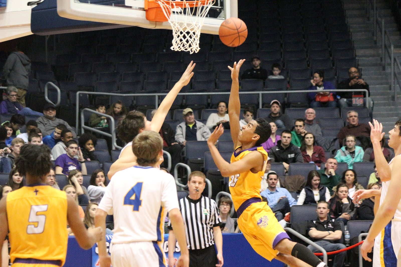 Emmanuel Christian’s Adonis Davis puts up a shot against Russia in Friday night’s Division IV district title game at UD Arena. Greg Billing/CONTRIBUTED