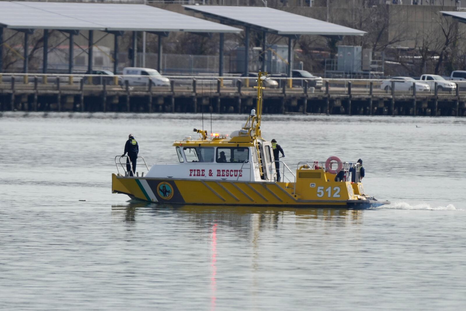 Search and rescue efforts are seen around a wreckage site in the Potomac River from Ronald Reagan Washington National Airport, early Thursday morning, Jan. 30, 2025, in Arlington, Va. (AP Photo/Carolyn Kaster)