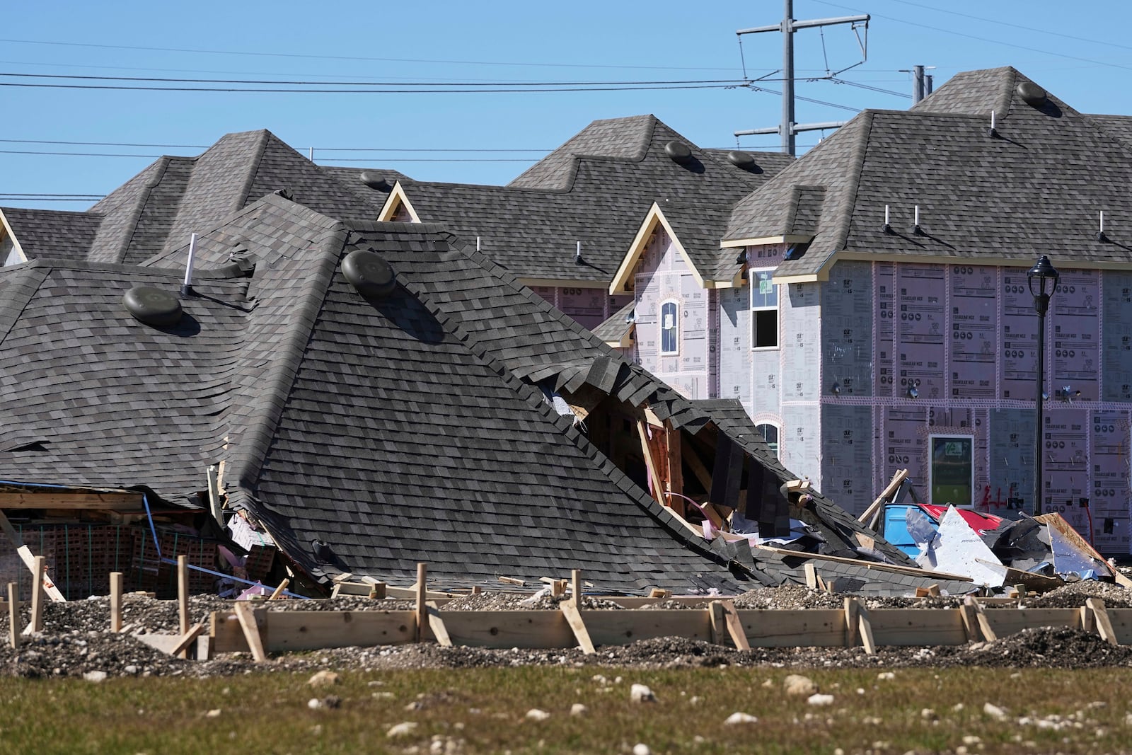 Homes that were under construction sit destroyed after recent severe weather passed through the area in Haslet, Texas, Wednesday, March 5, 2025. (AP Photo/Tony Gutierrez)