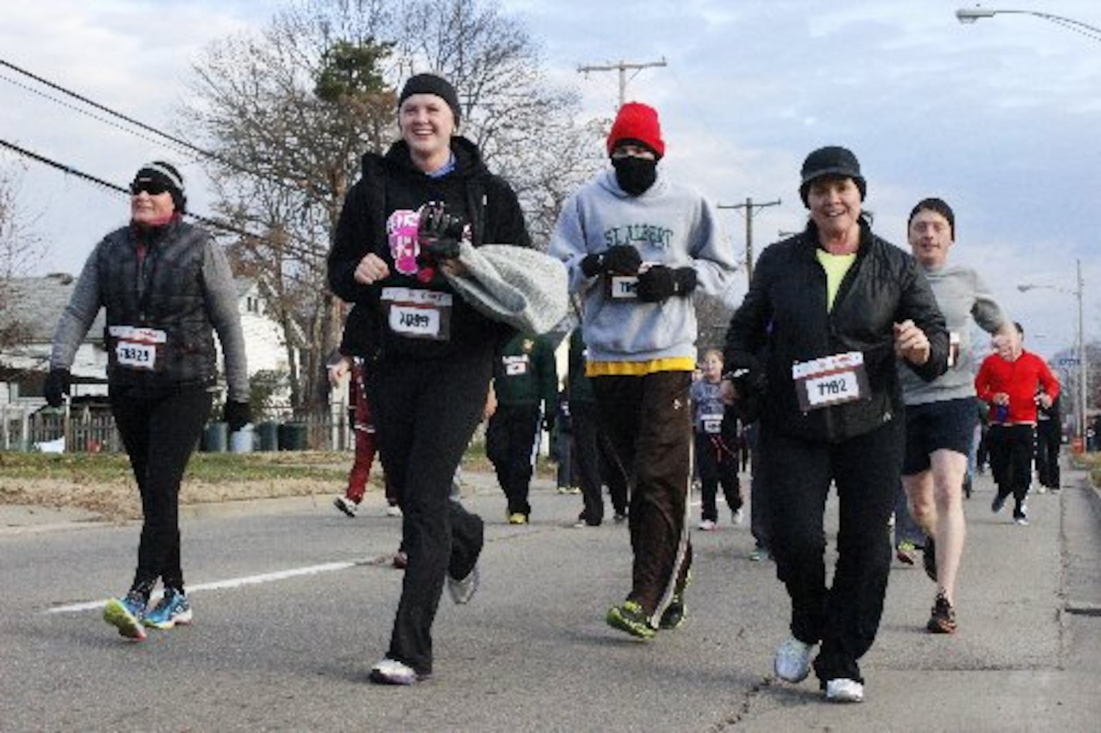 A record 10, 725 runners and walkers registered for the 35th Annual Ohio River Road Runners Club’s Turkey Trot held Thanksgving Day in Miamisburg. This was the first year of a new route for the course. Traffic for the fun run caused a bottleneck. Michael Franz / STAFF