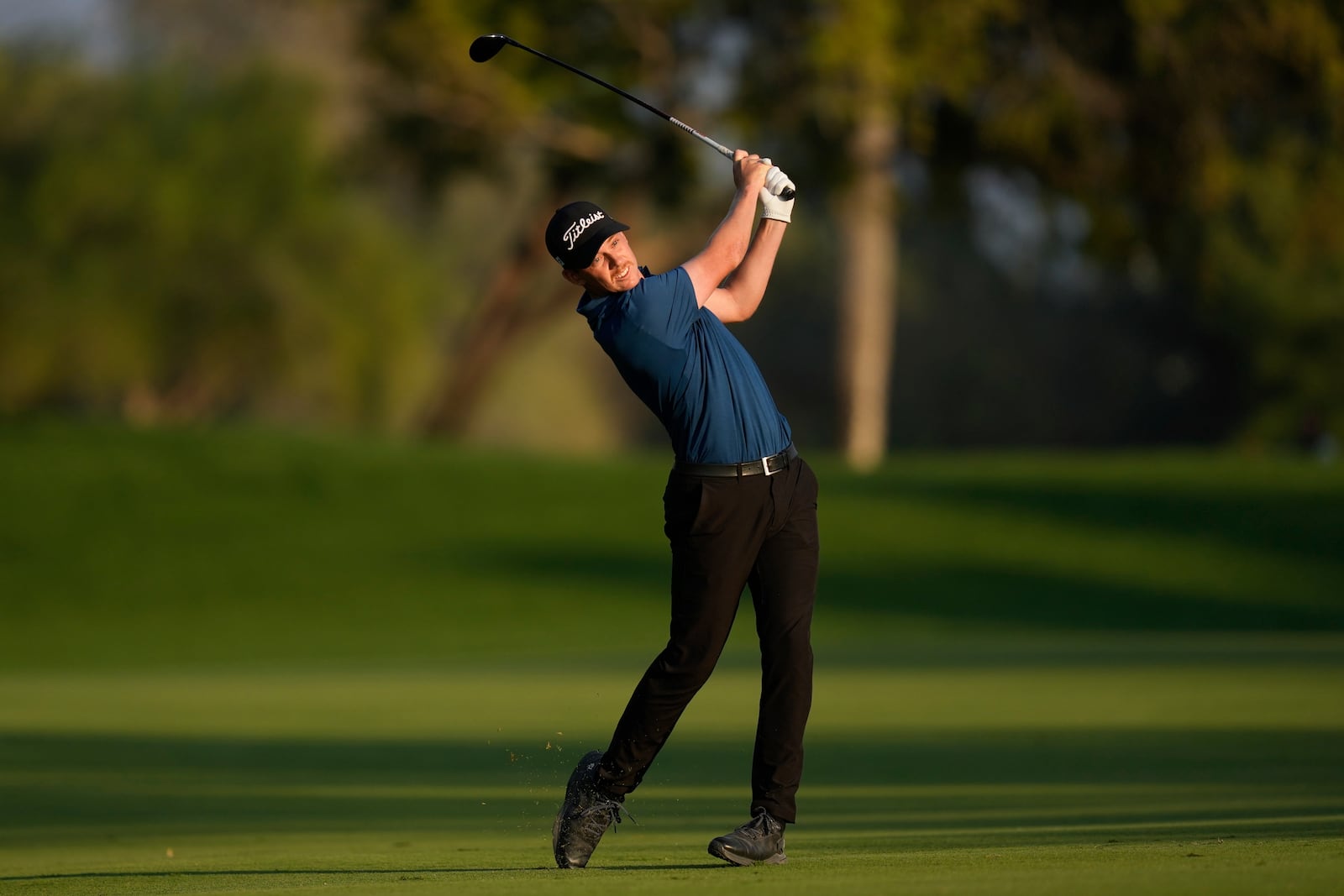 Daniel Hillier of New Zealand plays his second shot on the 18th hole during the final round of the Dubai Desert Classic golf tournament, in Dubai, United Arab Emirates, Sunday, Jan. 19, 2025. (AP Photo/Altaf Qadri)