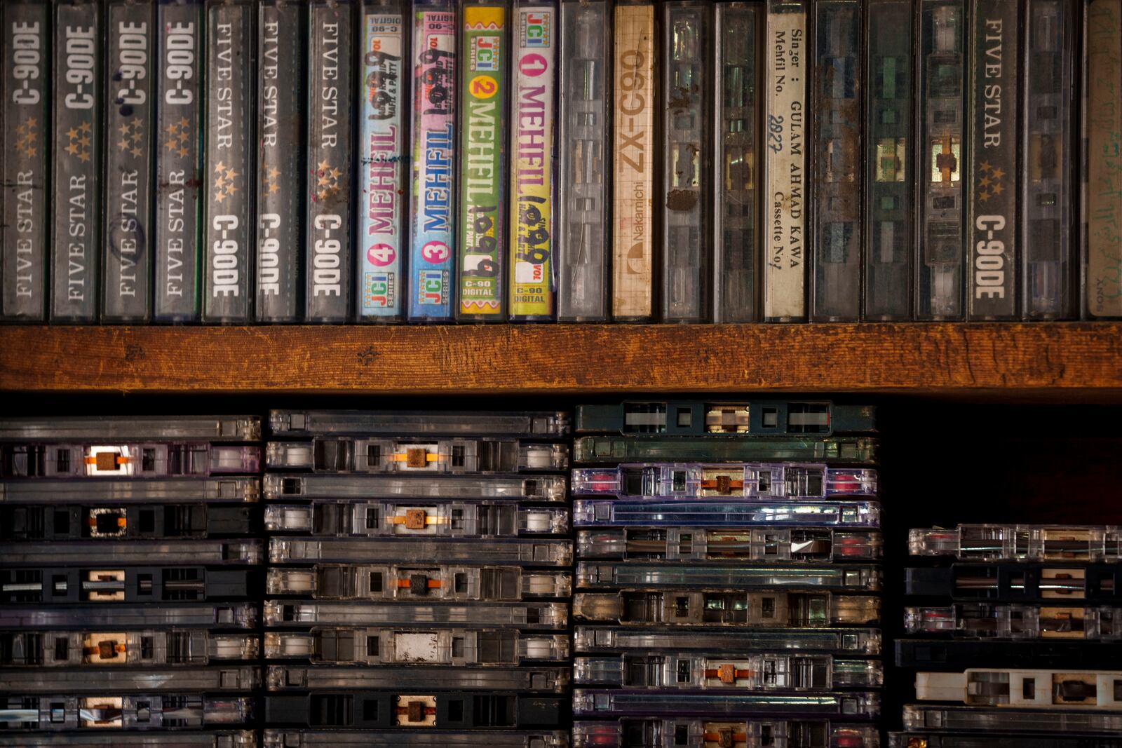 Old and damaged cassette tapes are stacked on a shelf at self-taught mechanic Mohammad Ashraf Matoo’s workshop in Srinagar, Indian controlled Kashmir, Tuesday, Feb. 11, 2025. (AP Photo/Dar Yasin)