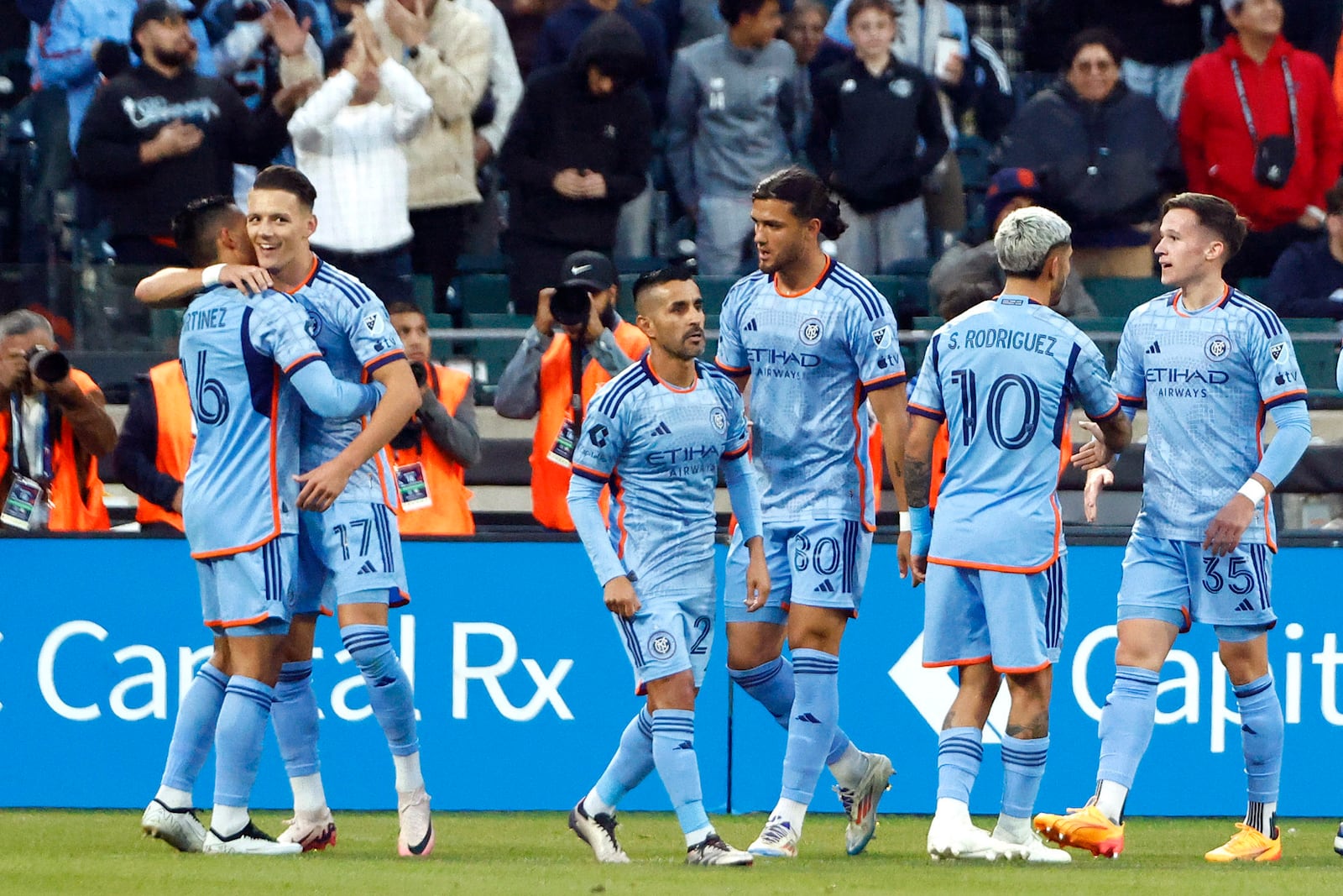 New York City FC's Adrian Martinez (16) is congratulated by teammates after scoring a goal against FC Cincinnati during the first half in Game 2 in the first round of the MLS Cup soccer playoffs, Saturday, Nov. 2, 2024, in New York. (AP Photo/Kena Betancur)