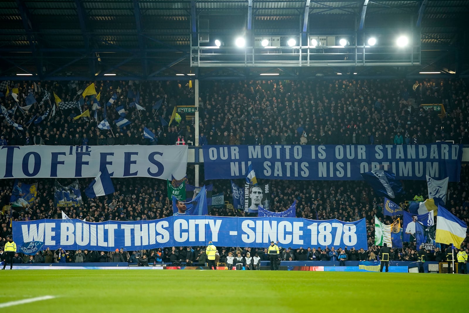 Supporters of Everton hold banners ahead of the English Premier League soccer match between Everton and Liverpool, Liverpool, England, Wednesday, Feb.12, 2025. (AP Photo/Dave Thompson)