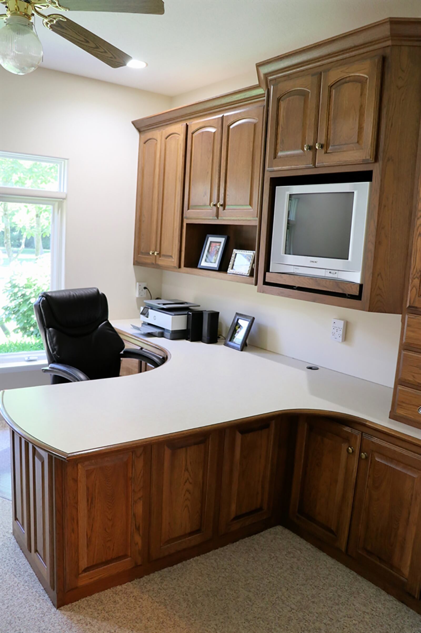 Double doors open into an executive study with built-in hickory desk and credenza. CONTRIBUTED PHOTO BY KATHY TYLER