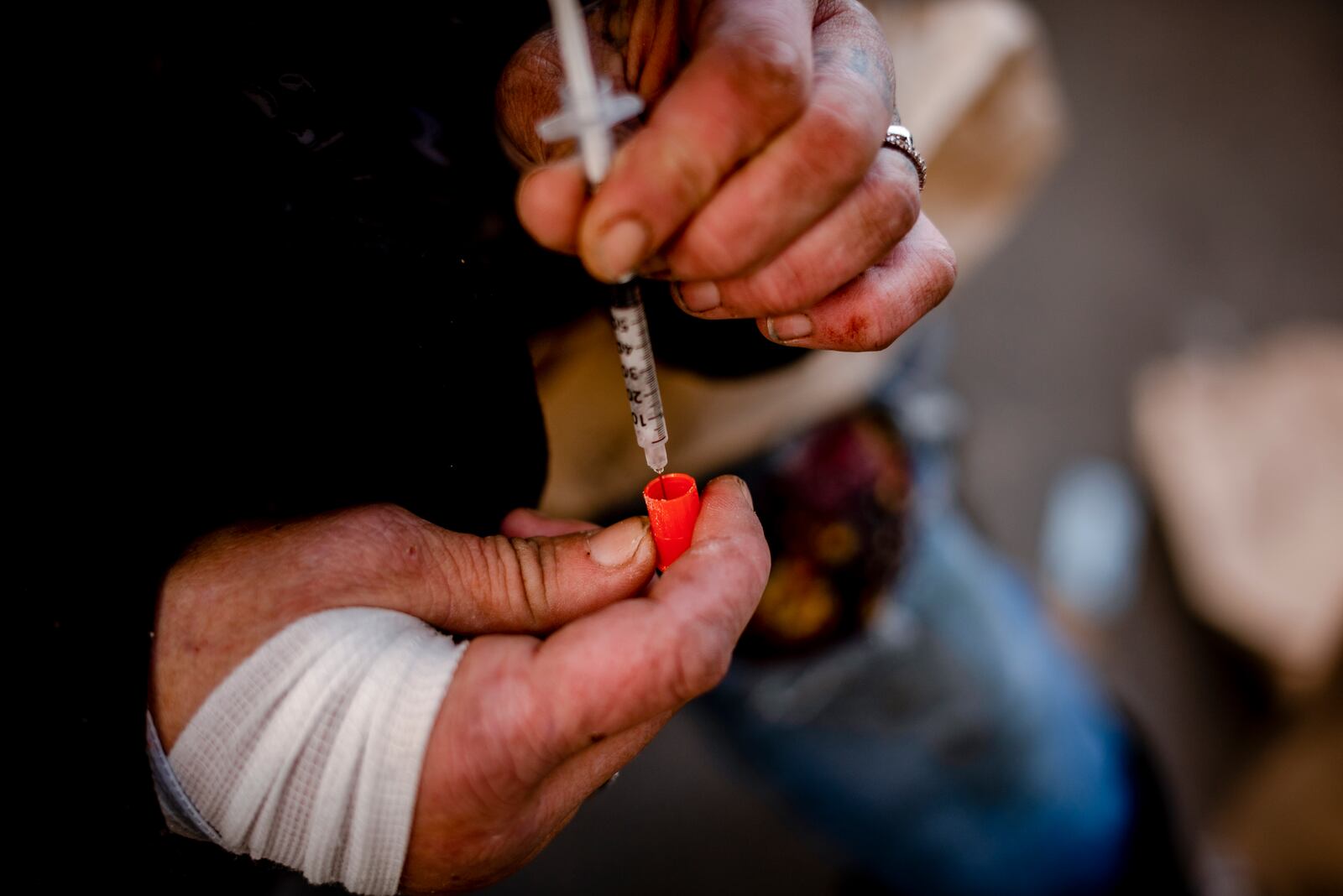 
                        FILE — A woman prepares a shot of cocaine that she says is mixed with xylazine, in Kensington, Pa., on Dec. 13, 2022. The use of xylazine, a cheap, addictive adulterant that has been a staple for veterinary procedures on cattle and horses, began in the Northeast and then rapidly spread west and south. (Hilary Swift/The New York Times)
                      