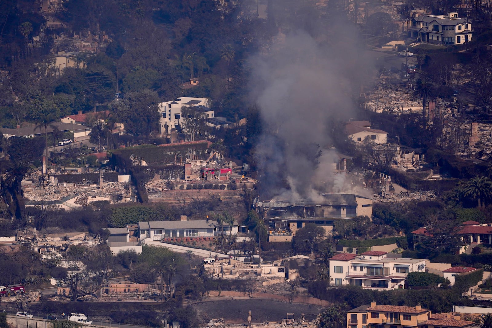 The devastation from the Palisades Fire is seen from the air in the Pacific Palisades neighborhood of Los Angeles, Thursday, Jan. 9, 2025. (AP Photo/Mark J. Terrill)