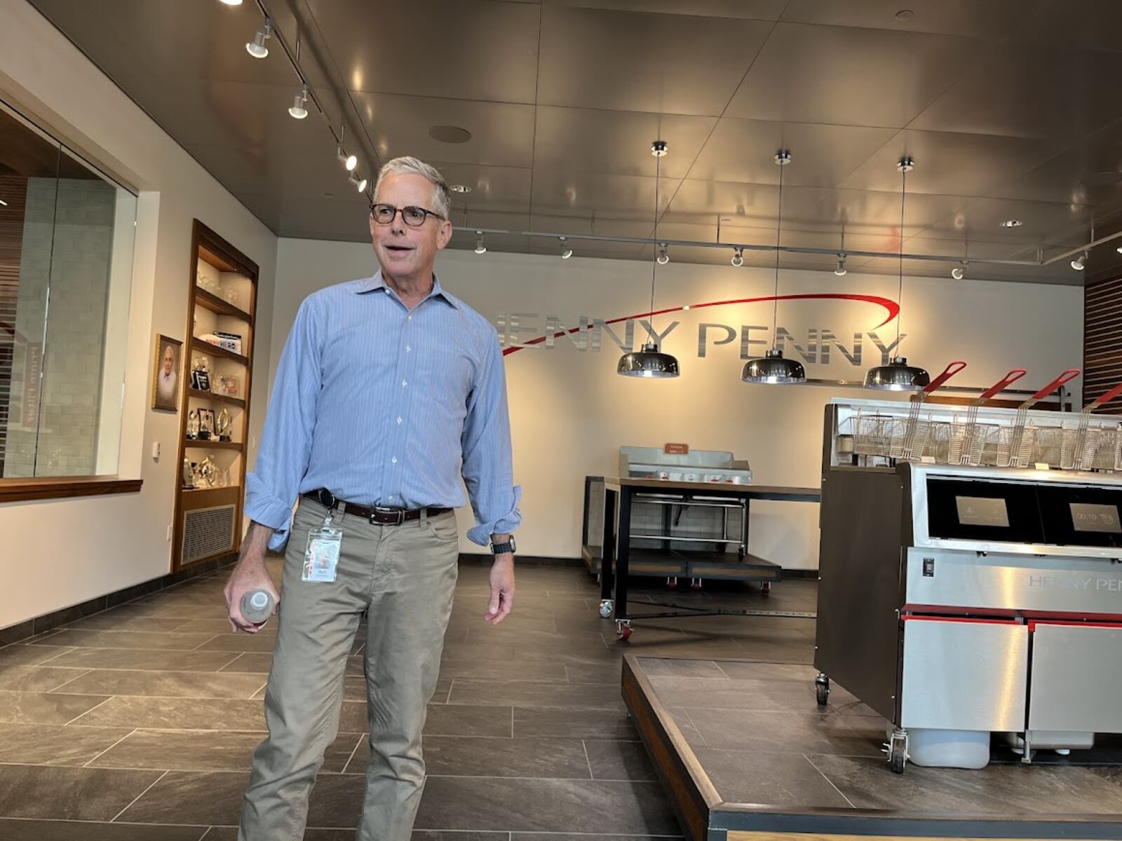 Rob Connelly, executive chairman of Henny Penny, gives guests a tour of one of the company's buildings off U.S. 35 in Eaton. THOMAS GNAU/STAFF