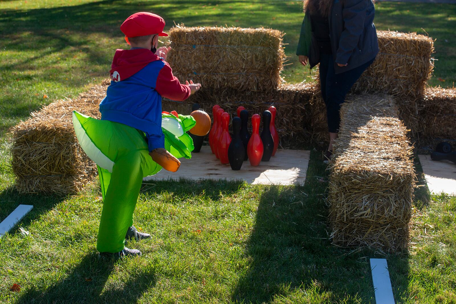 Skylar McVay, dressed in a Mario-themed costume, plays “pumpkin bowling” as part of the Great Pumpkin Off and “Trunk or Treat” event Oct. 21 at Wright-Patterson Air Force Base. U.S. AIR FORCE PHOTO/SENIOR AIRMAN JACK GARDNER