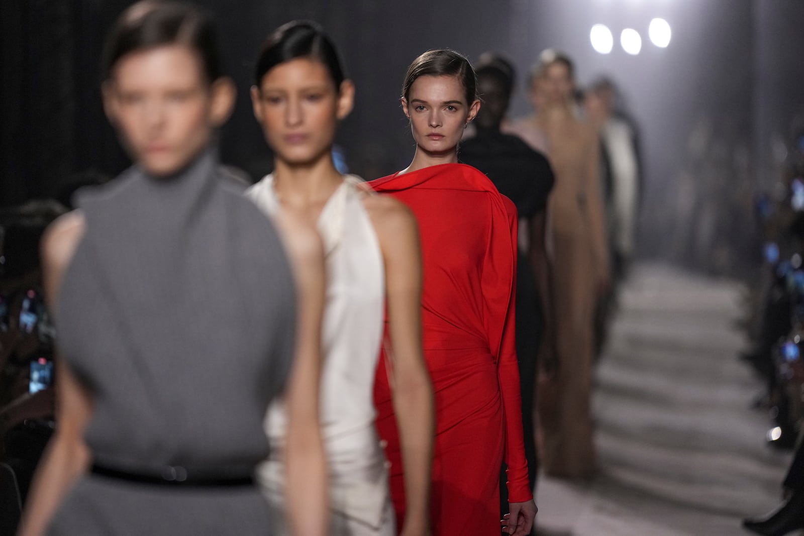 Models wear creations as part of the Victoria Beckham Fall/Winter 2025-2026 Womenswear collection presented in Paris, Friday, March 7, 2025. (Photo by Scott A Garfitt/Invision/AP)