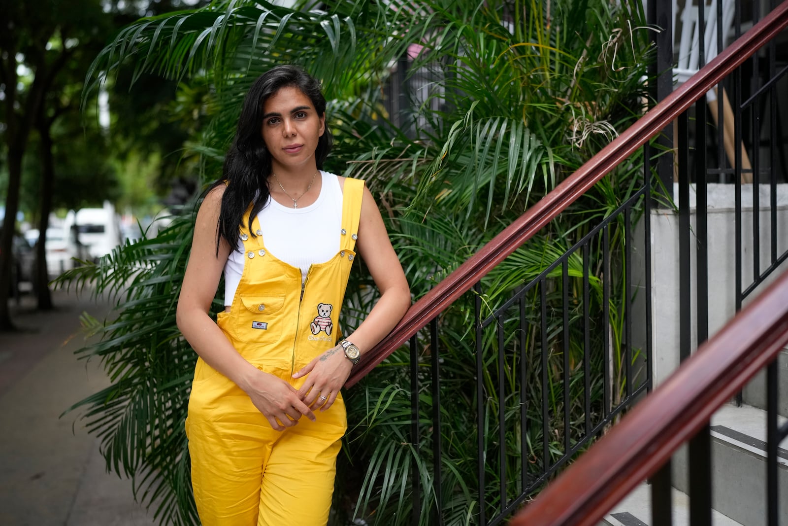 Artemis Ghasemzadeh, a migrant from Iran, poses for a portrait in Panama City, Monday, March 10, 2025, after being deported from the United States, detained for weeks in a Panamanian immigration camp, and released on a temporary humanitarian visa allowing a 30‑day stay. (AP Photo/Matias Delacroix)