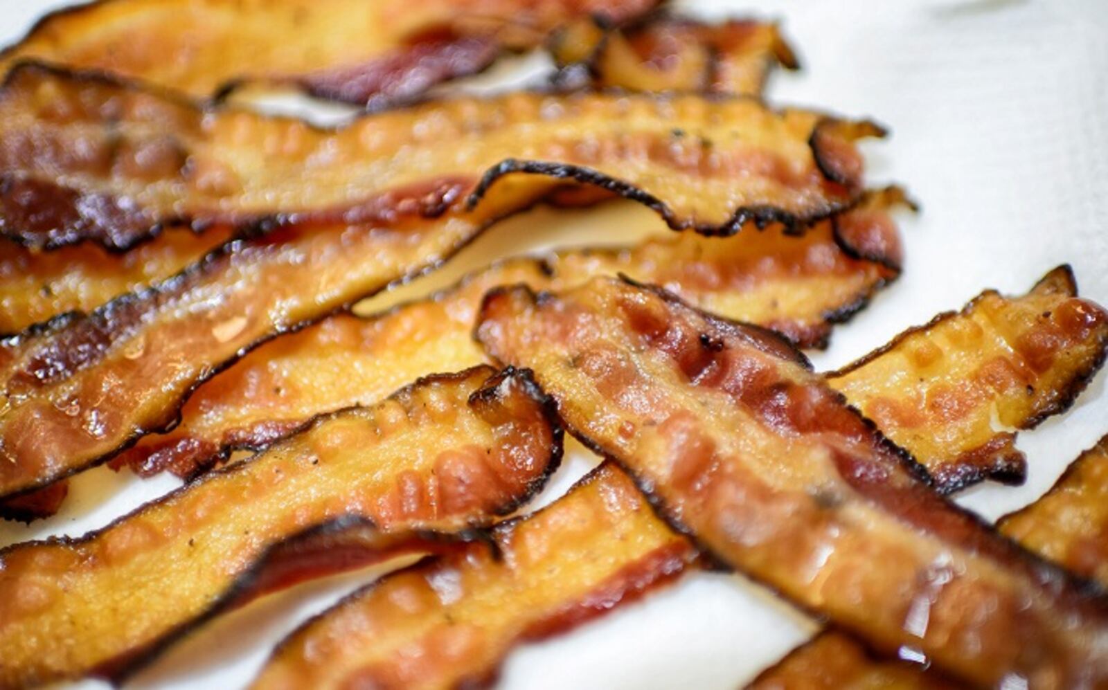 Bacon isn't going to disappear; if anything, it's just going to get harder to find - and, by extension - more expensive. (Glen Stubbe/Minneapolis Star Tribune/TNS)