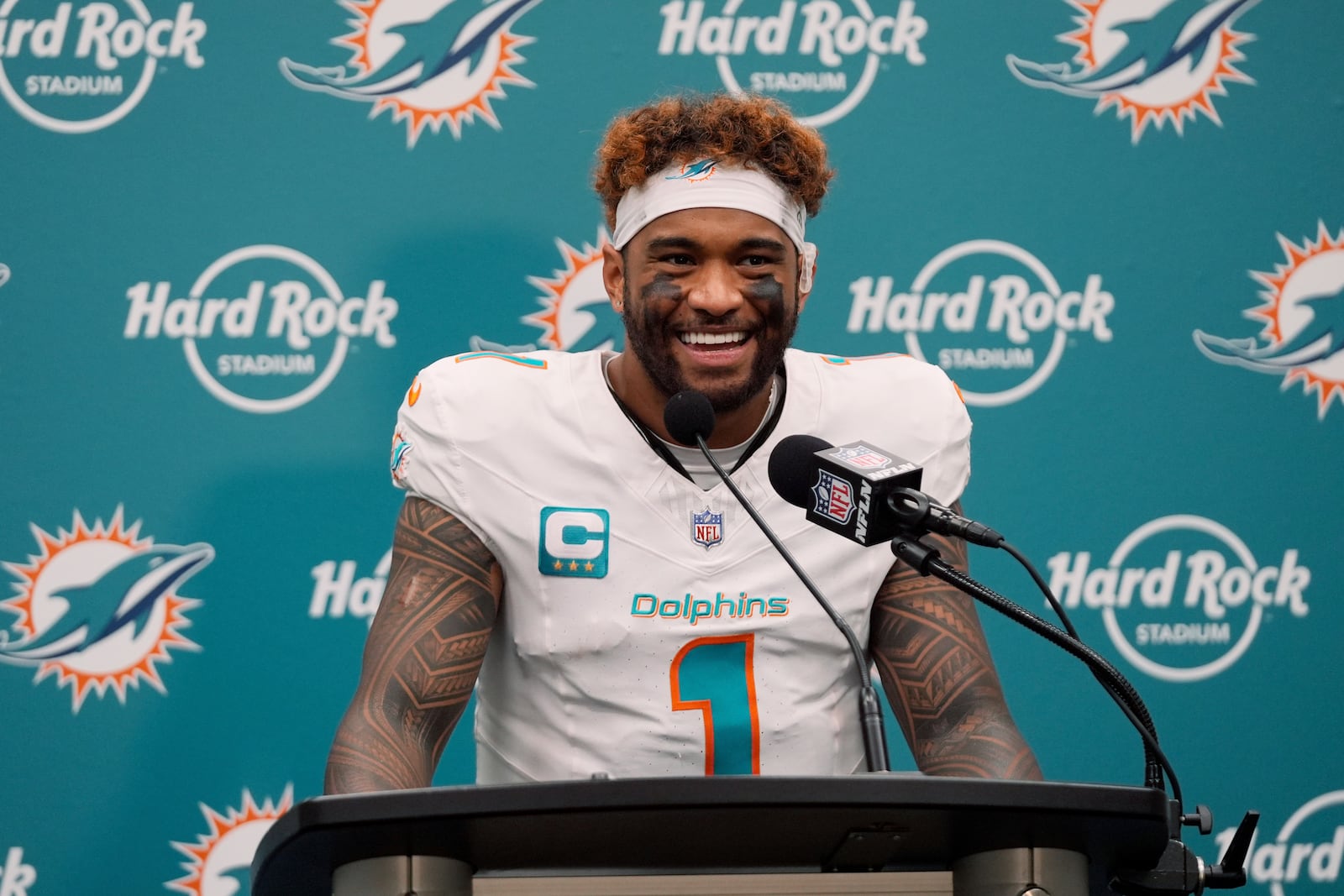 Miami Dolphins quarterback Tua Tagovailoa (1) speaks during a news conference following an NFL football game against the New York Jets, Sunday, Dec. 8, 2024, in Miami Gardens, Fla. (AP Photo/Wilfredo Lee)