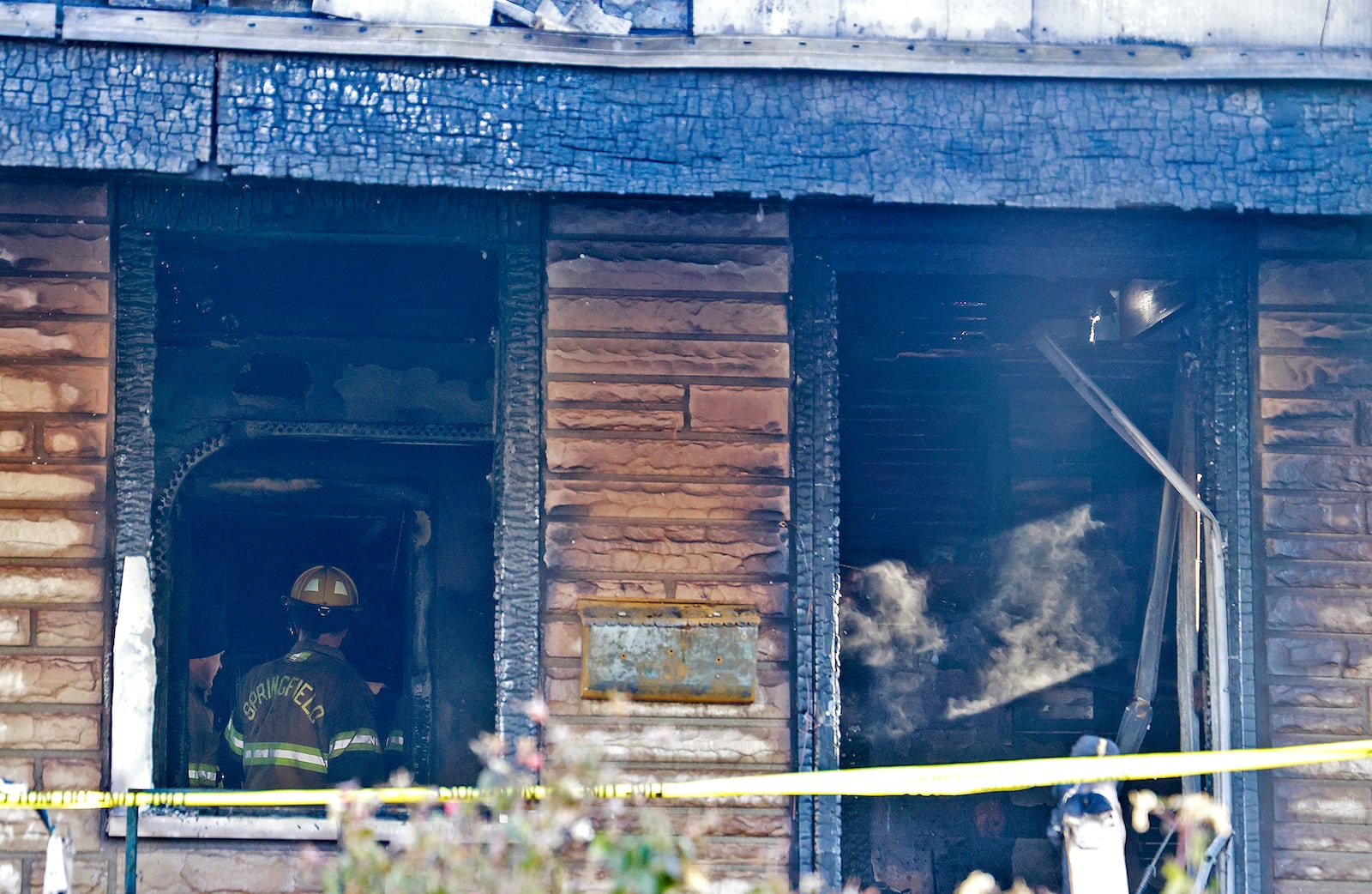 Two people were killed in a house fire early Saturday, Dec. 14, 2024 in the 1800 block of South Center Blvd. The Springfield Fire & Rescue Division arrived to find the front of the house fully engulfed in flames. As the firefighters tried to make entry into the house, one of the firefighters legs went through the floor so they had to attack the fire from the outside. BILL LACKEY/STAFF