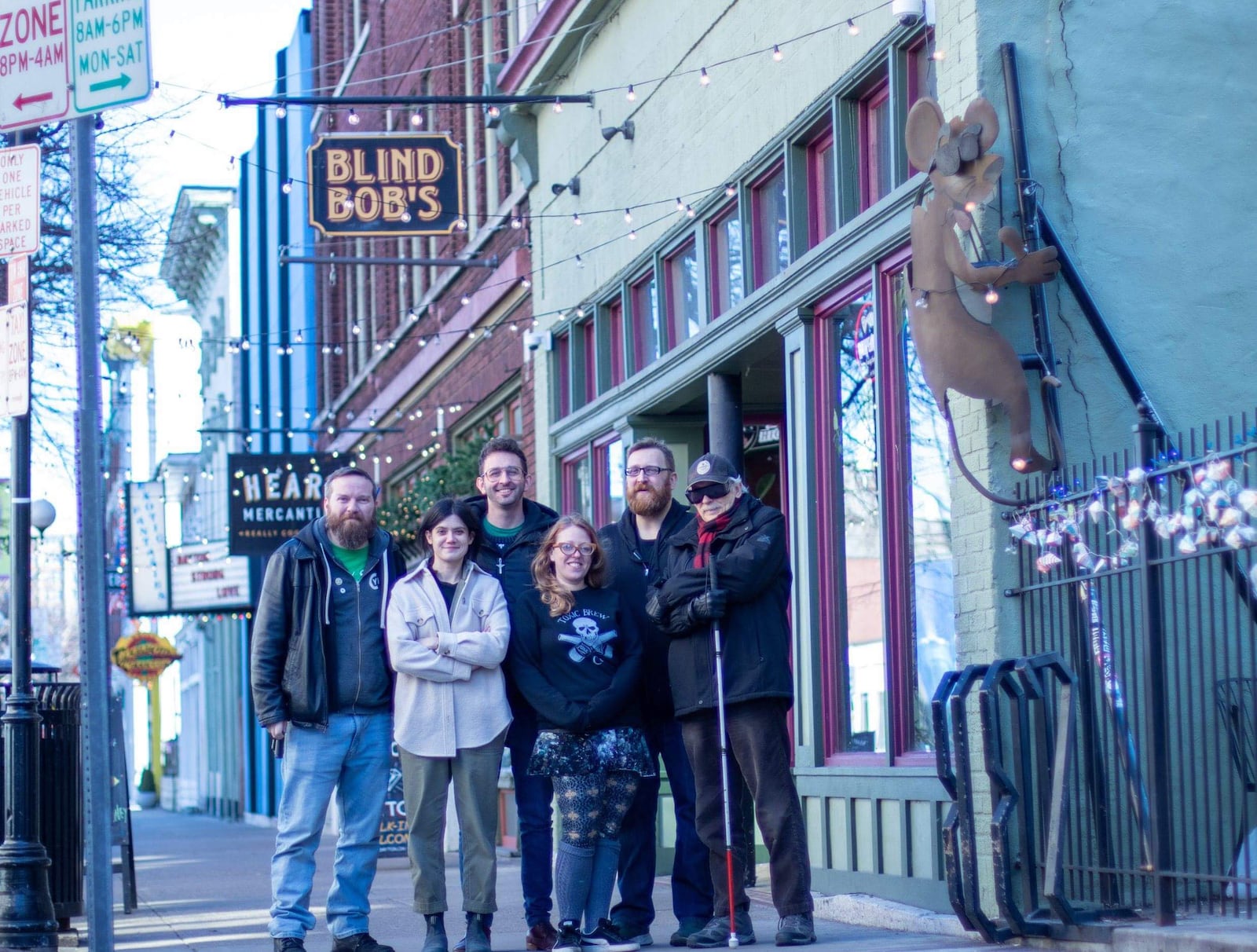 Blind Bob's Bar manager Andy Rowe, artist Atalie Gagnet,  musician Zack Sliver, artist Tiffany Clark and  Nate and Bob Mendenhall, the owners of Blind Bob's.